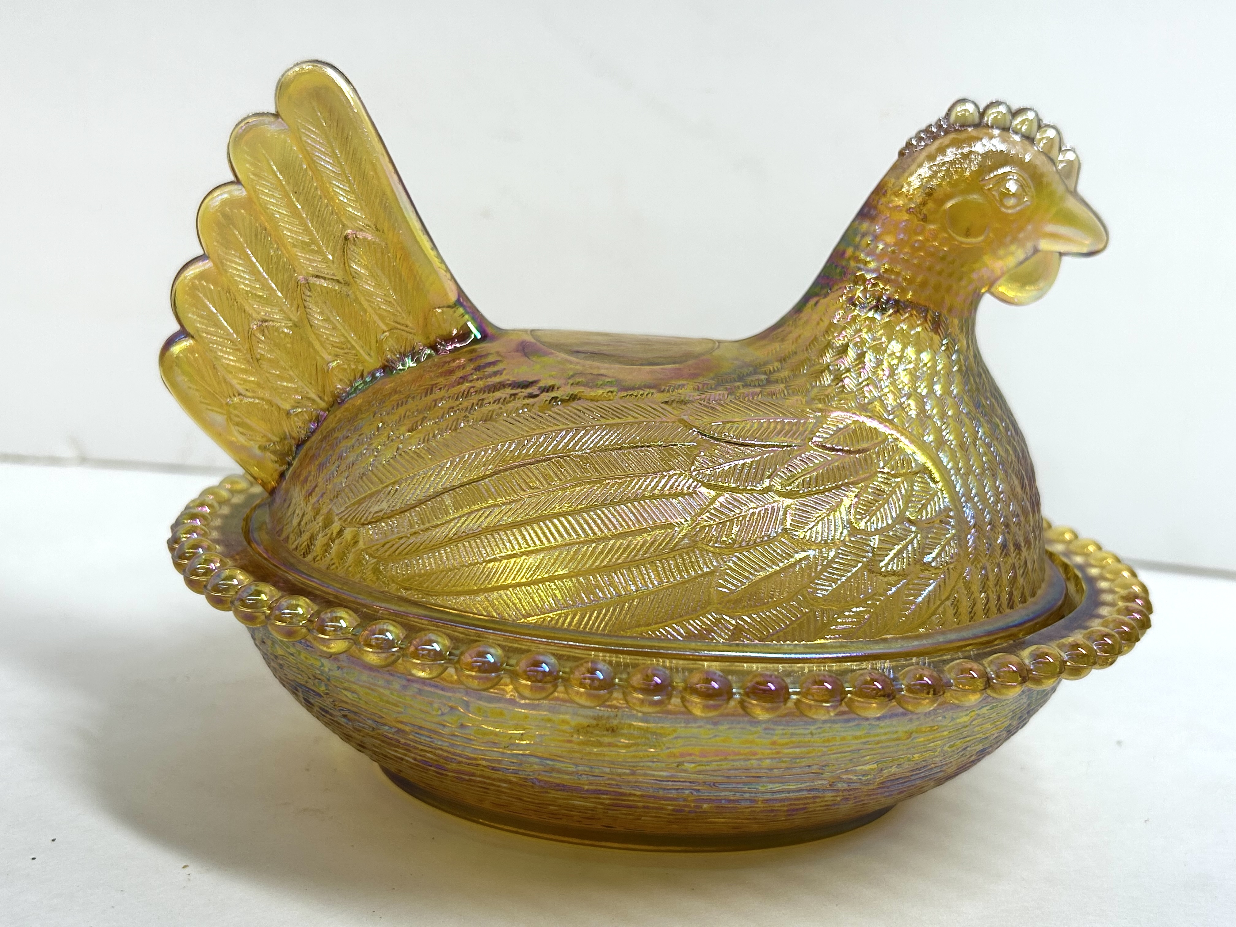 MARIGOLD IRIDESCENT GLASS HEN ON NEST DISH