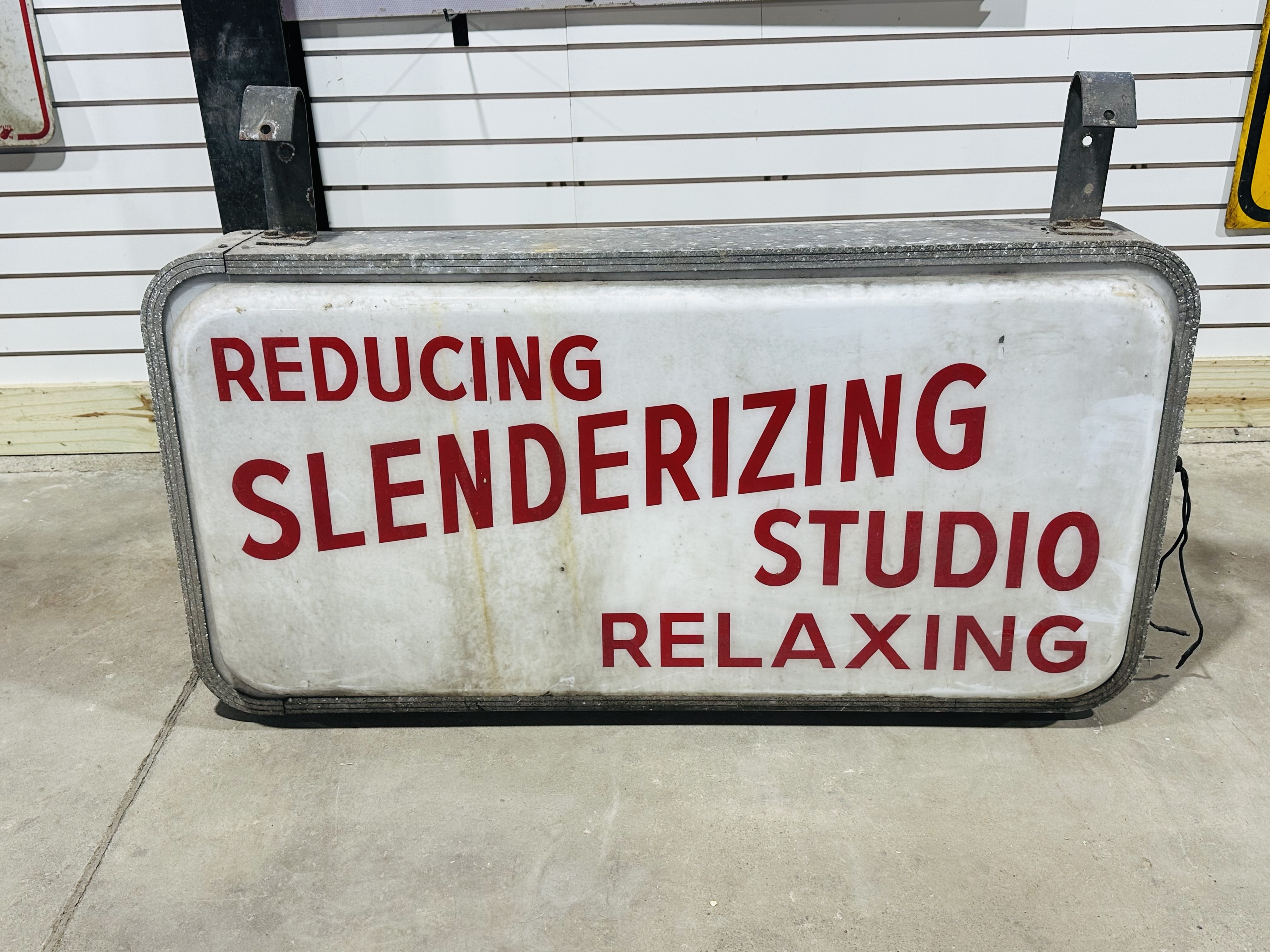 METAL SLENDERIZING STUDIO SIGN, CIRCA 1950