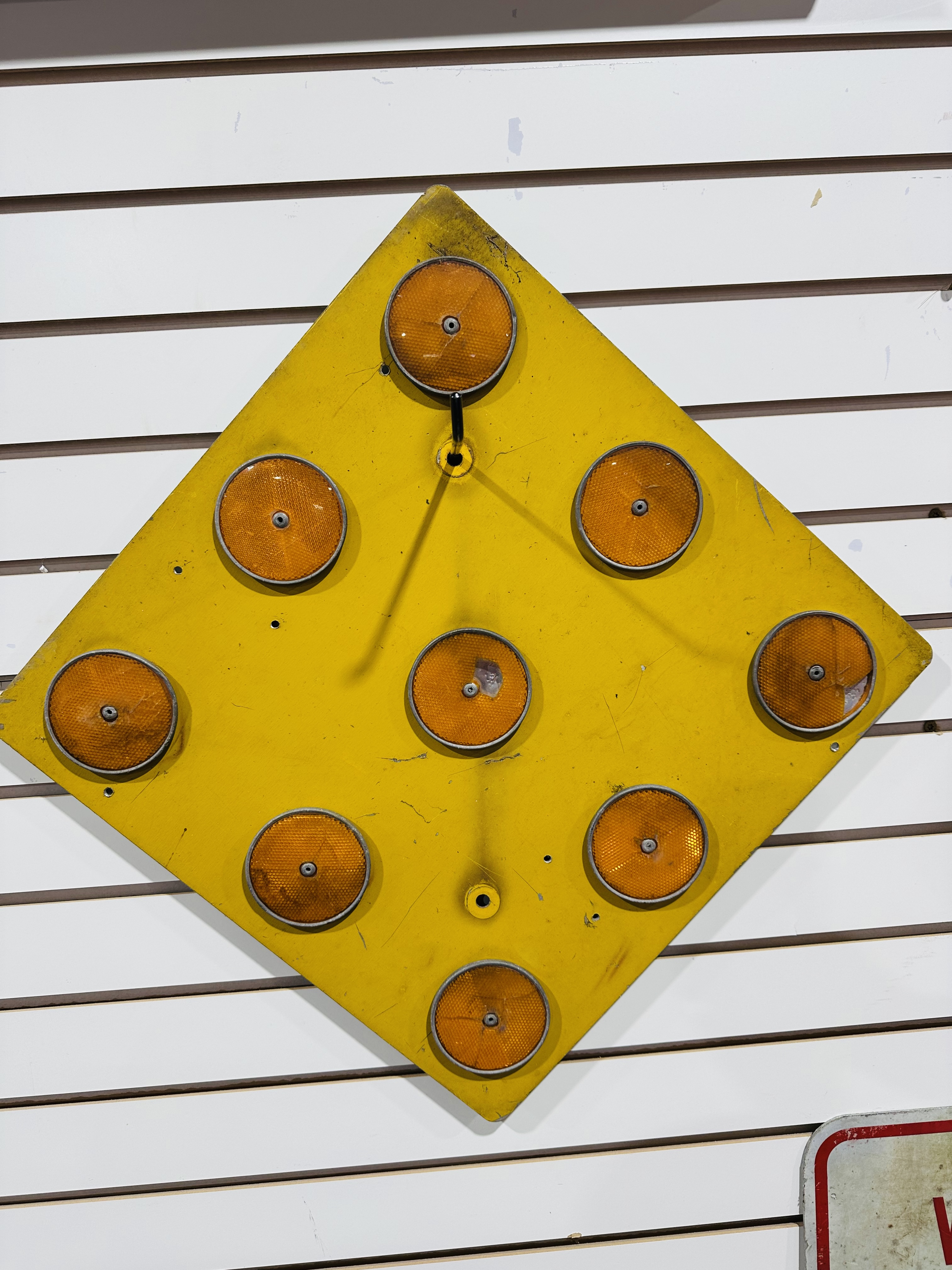 YELLOW METAL NINE-BUTTON OBJECT MARKER, 1990