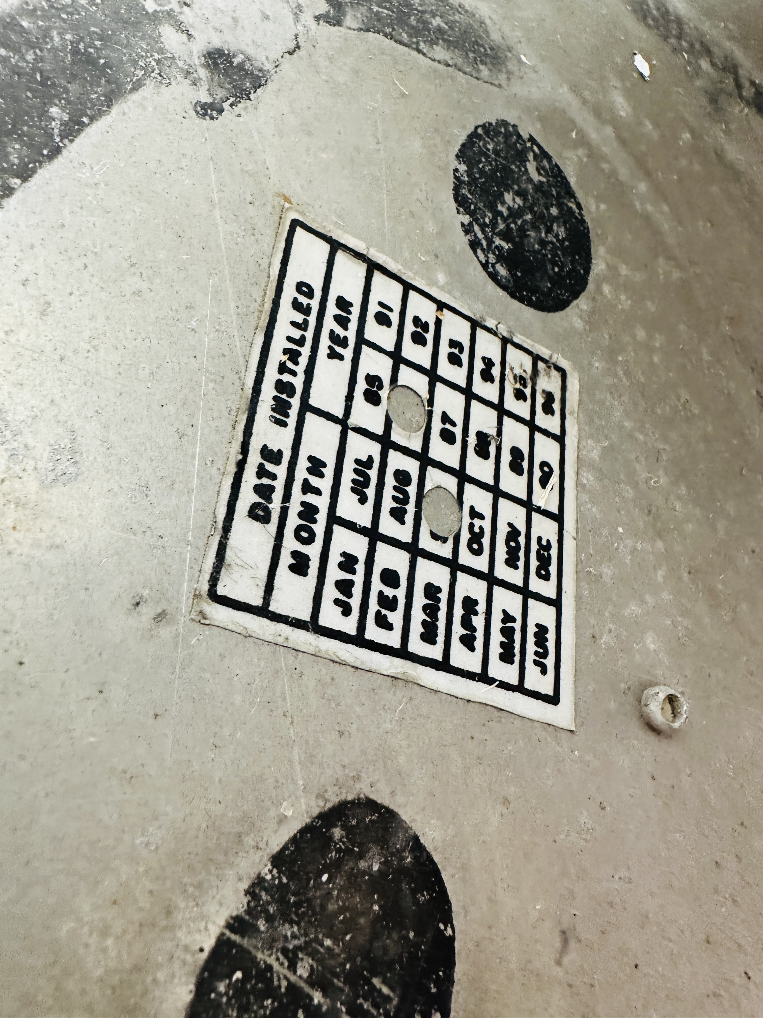 YELLOW METAL NINE-BUTTON OBJECT MARKER, 1990