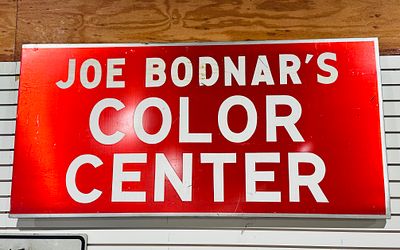 JOE BODNAR PAINTED METAL SIGN. A vintage rectangular painted metal advertising sign for Joe 