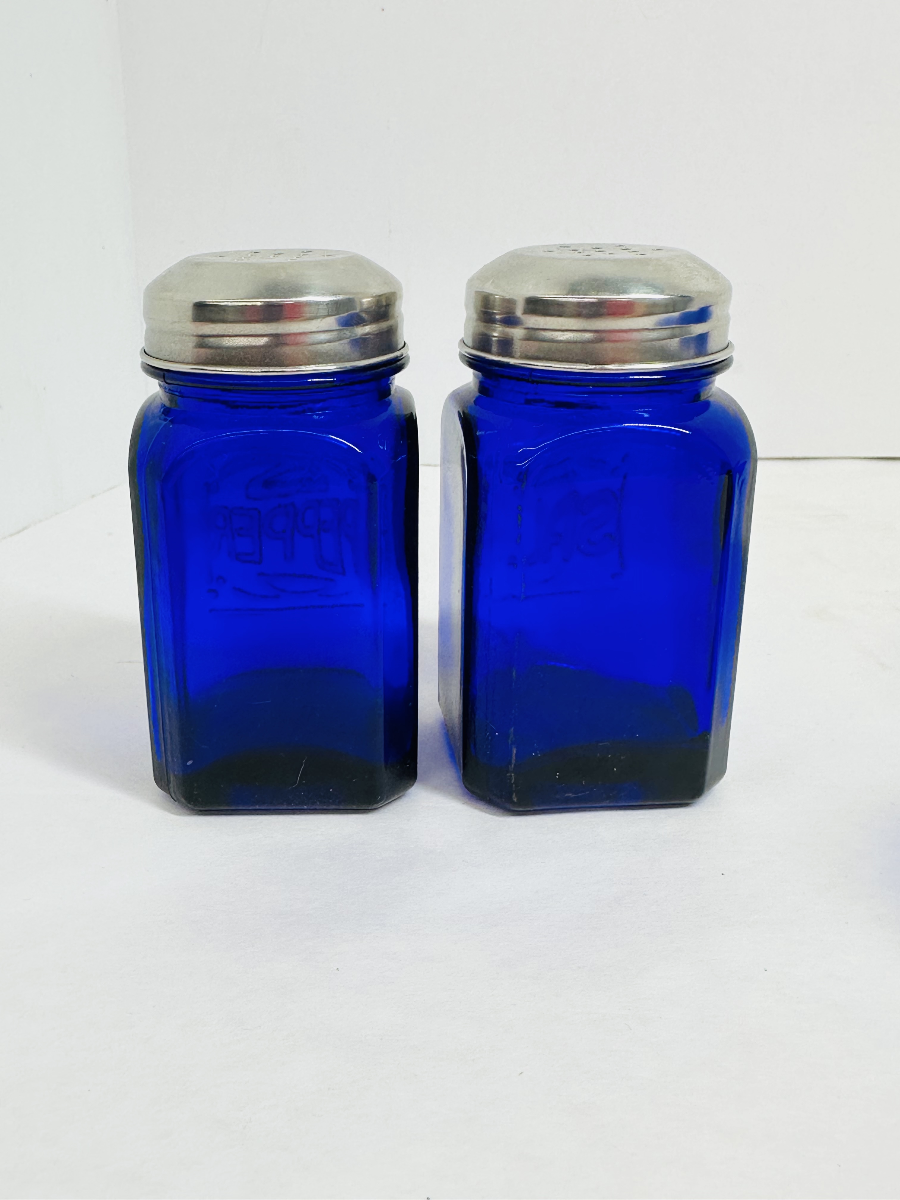 A COLLECTION OF COBALT BLUE GLASS KITCHENWARE