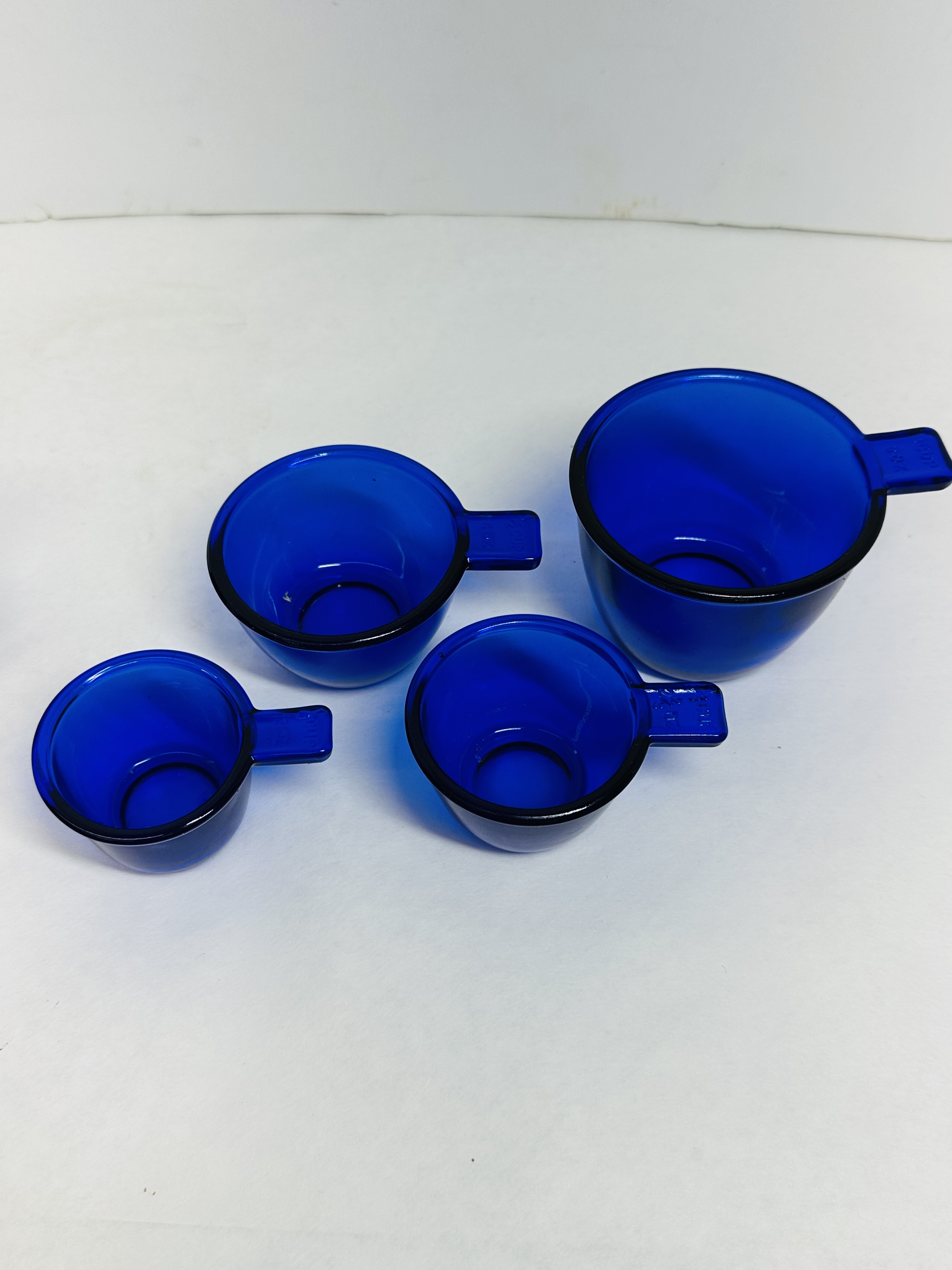 A COLLECTION OF COBALT BLUE GLASS KITCHENWARE
