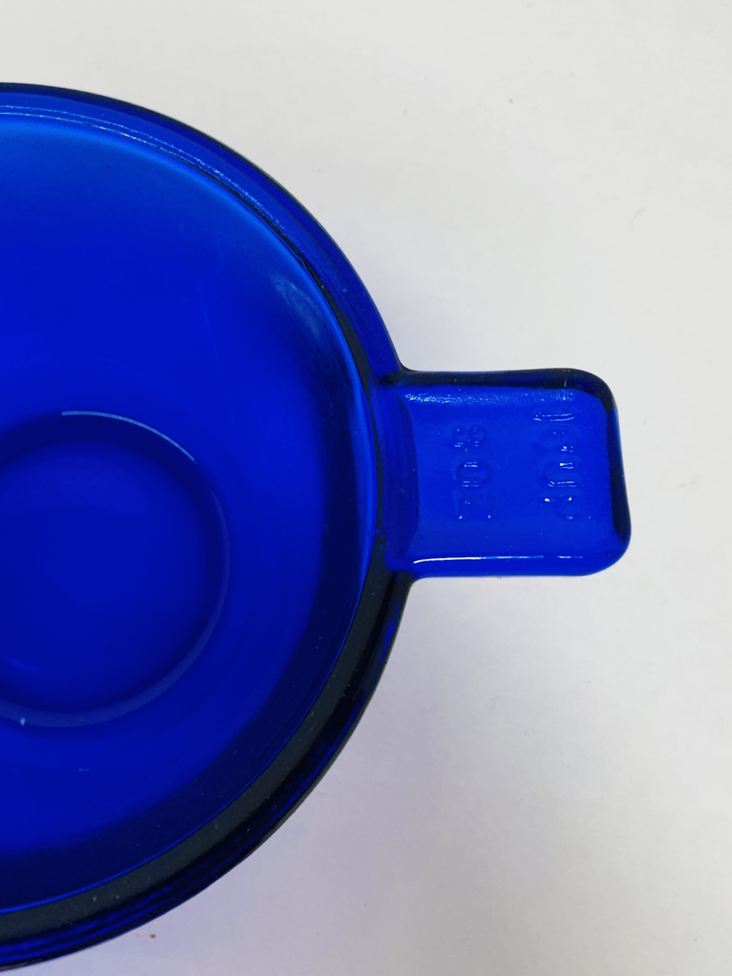 A COLLECTION OF COBALT BLUE GLASS KITCHENWARE