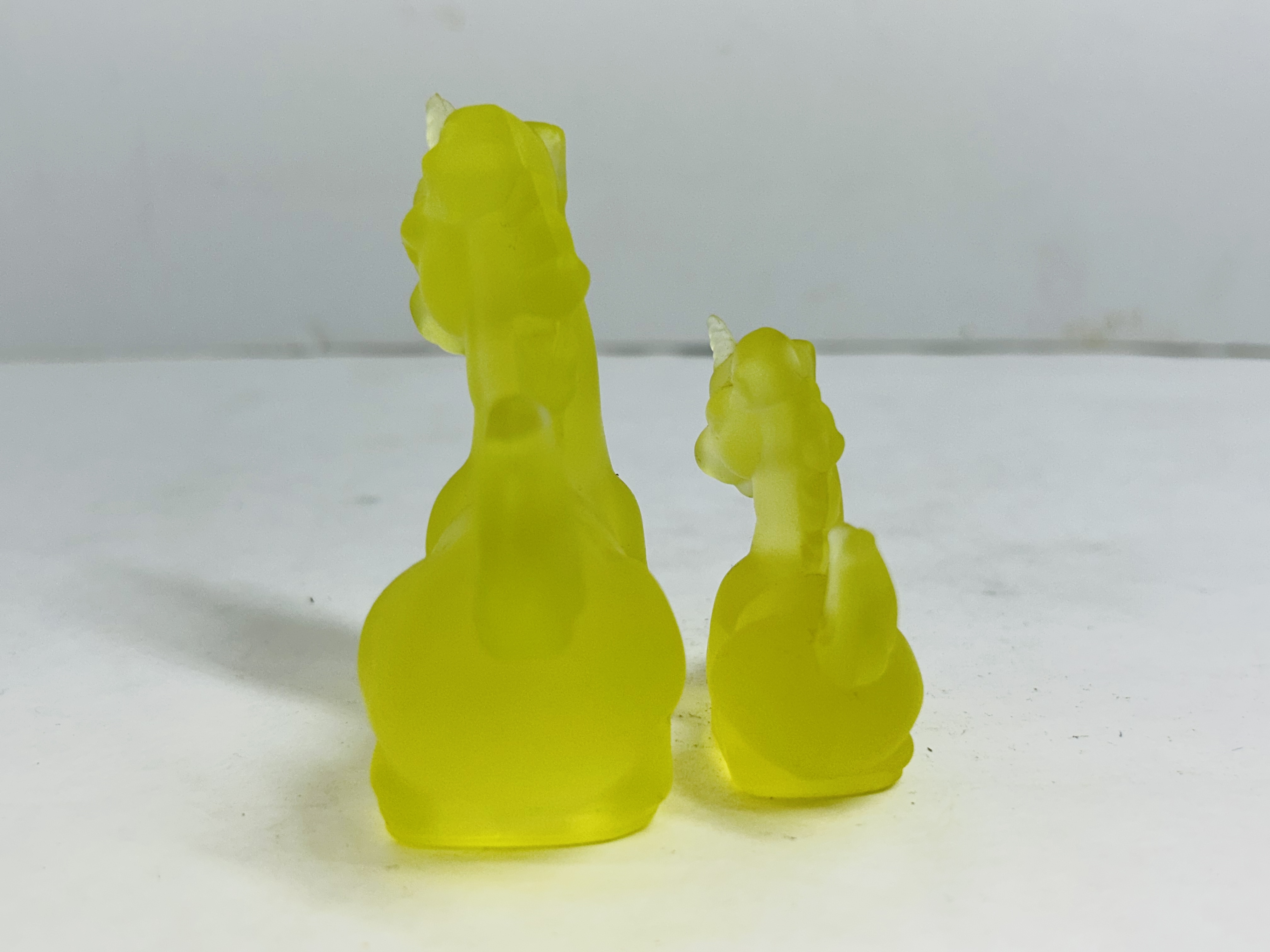 BOYD YELLOW GLASS UNICORNS, 20TH CENTURY