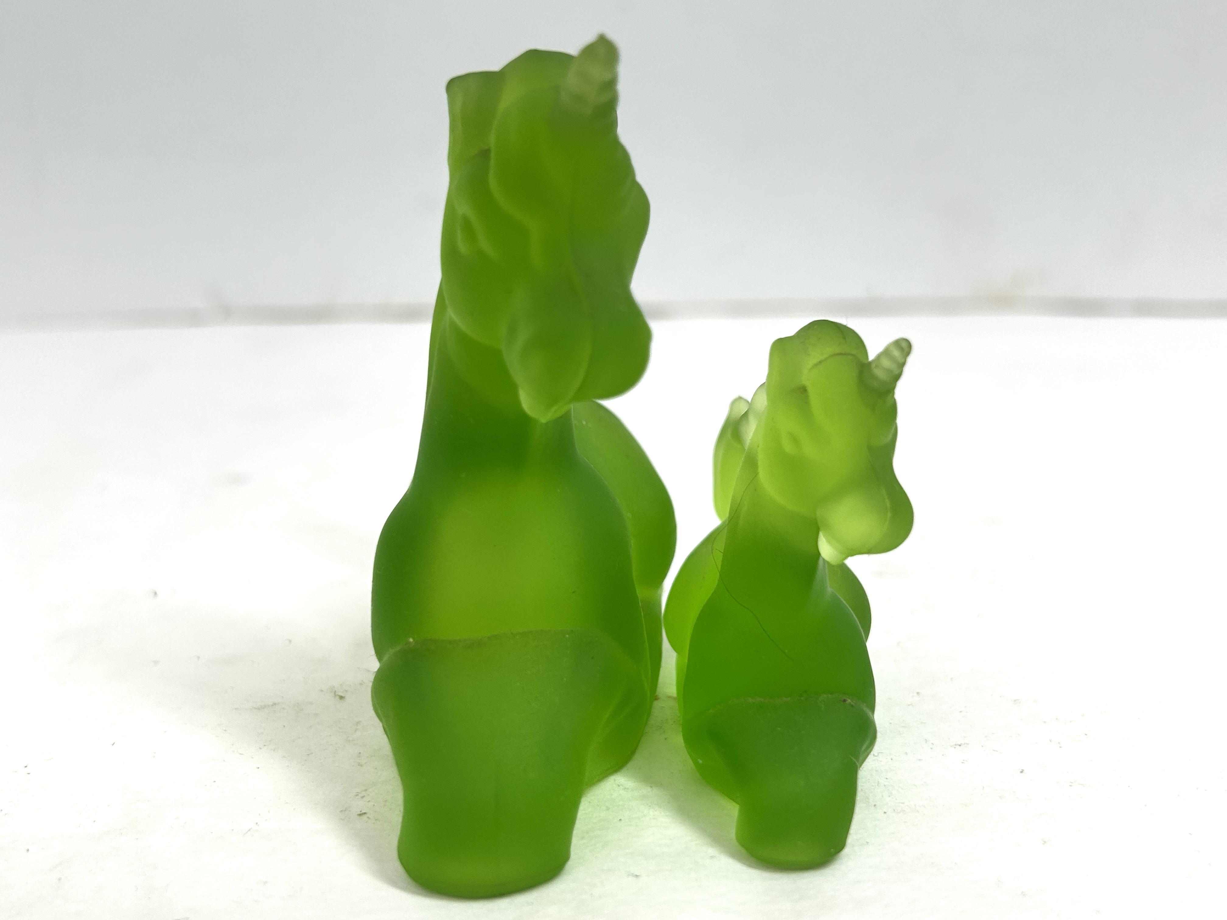 BOYD GREEN GLASS UNICORN PAIR, 1980S