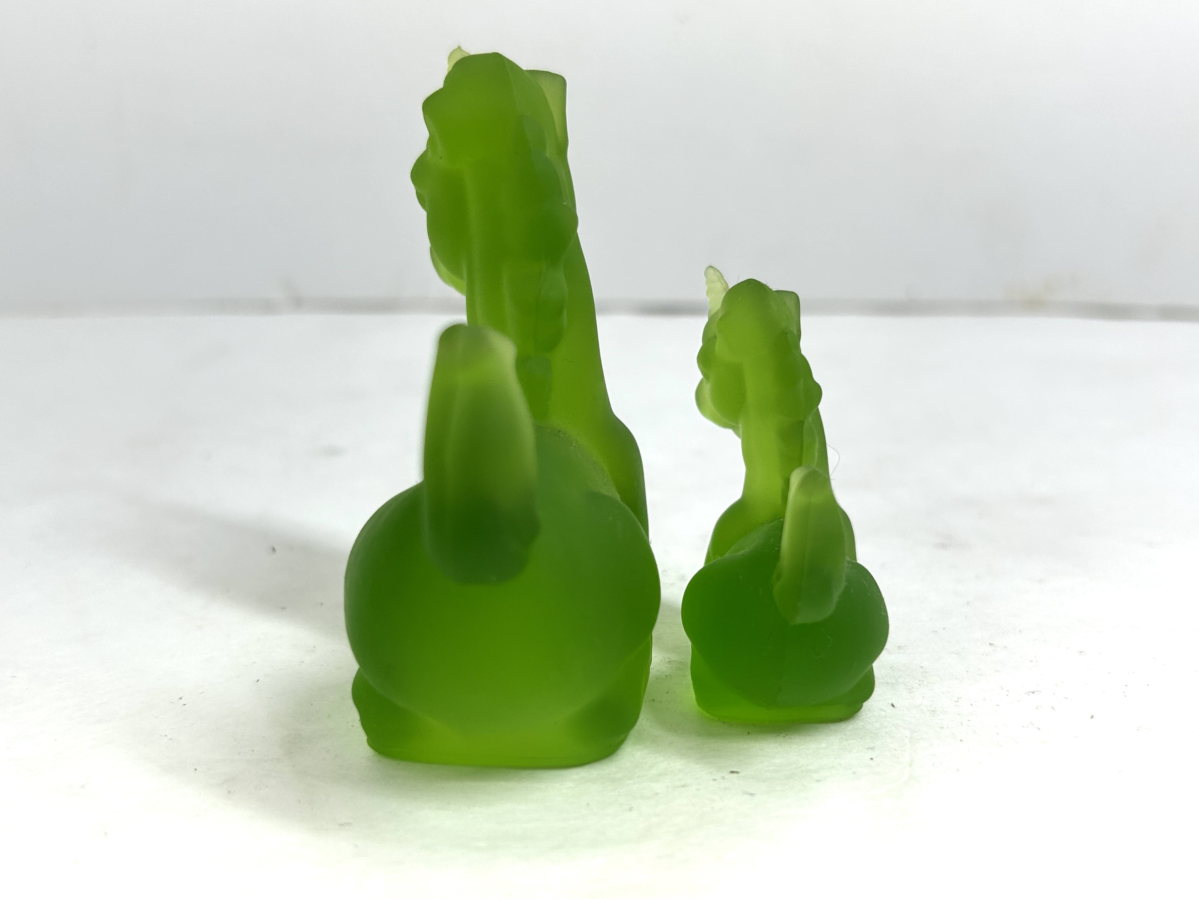 BOYD GREEN GLASS UNICORN PAIR, 1980S