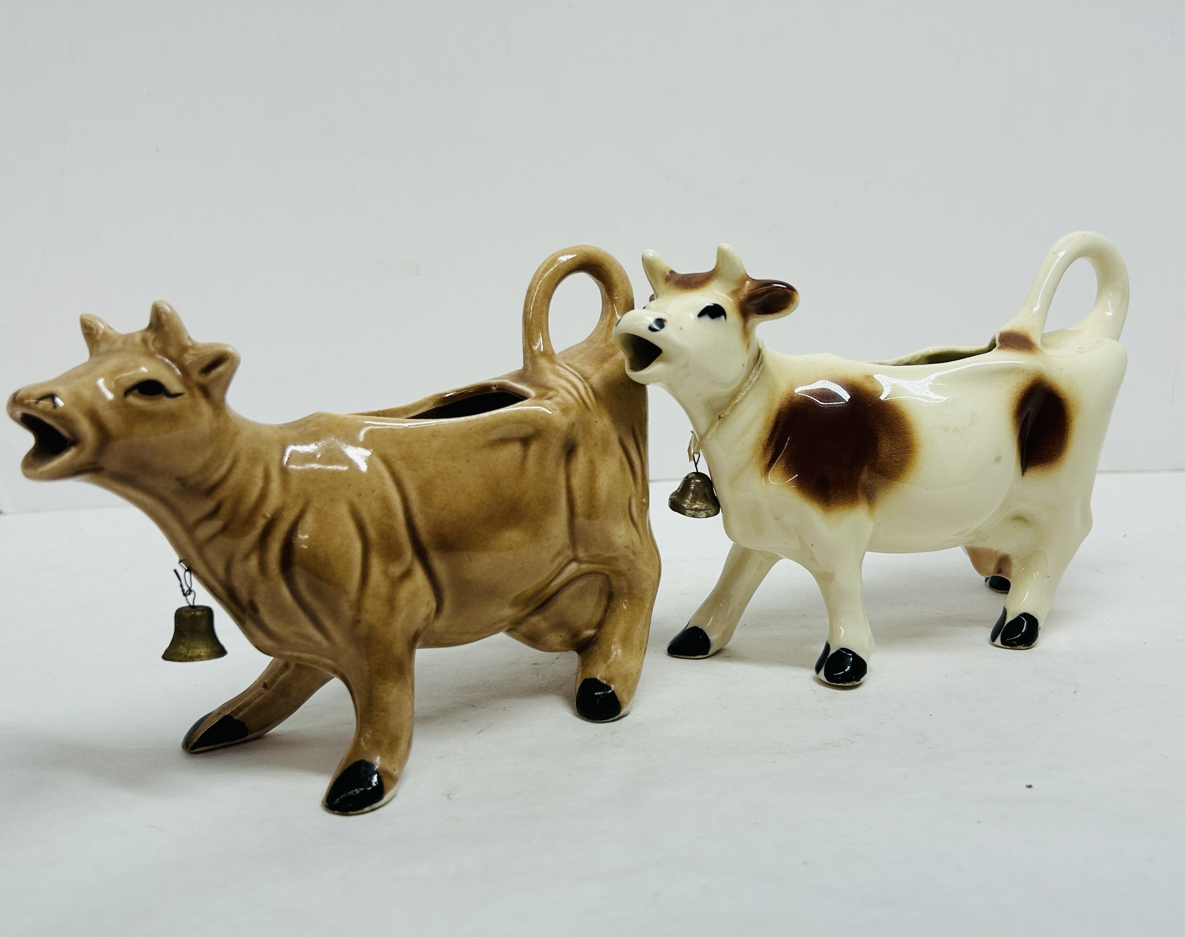CERAMIC COW CREAMER PAIR, MID-20TH CENTURY