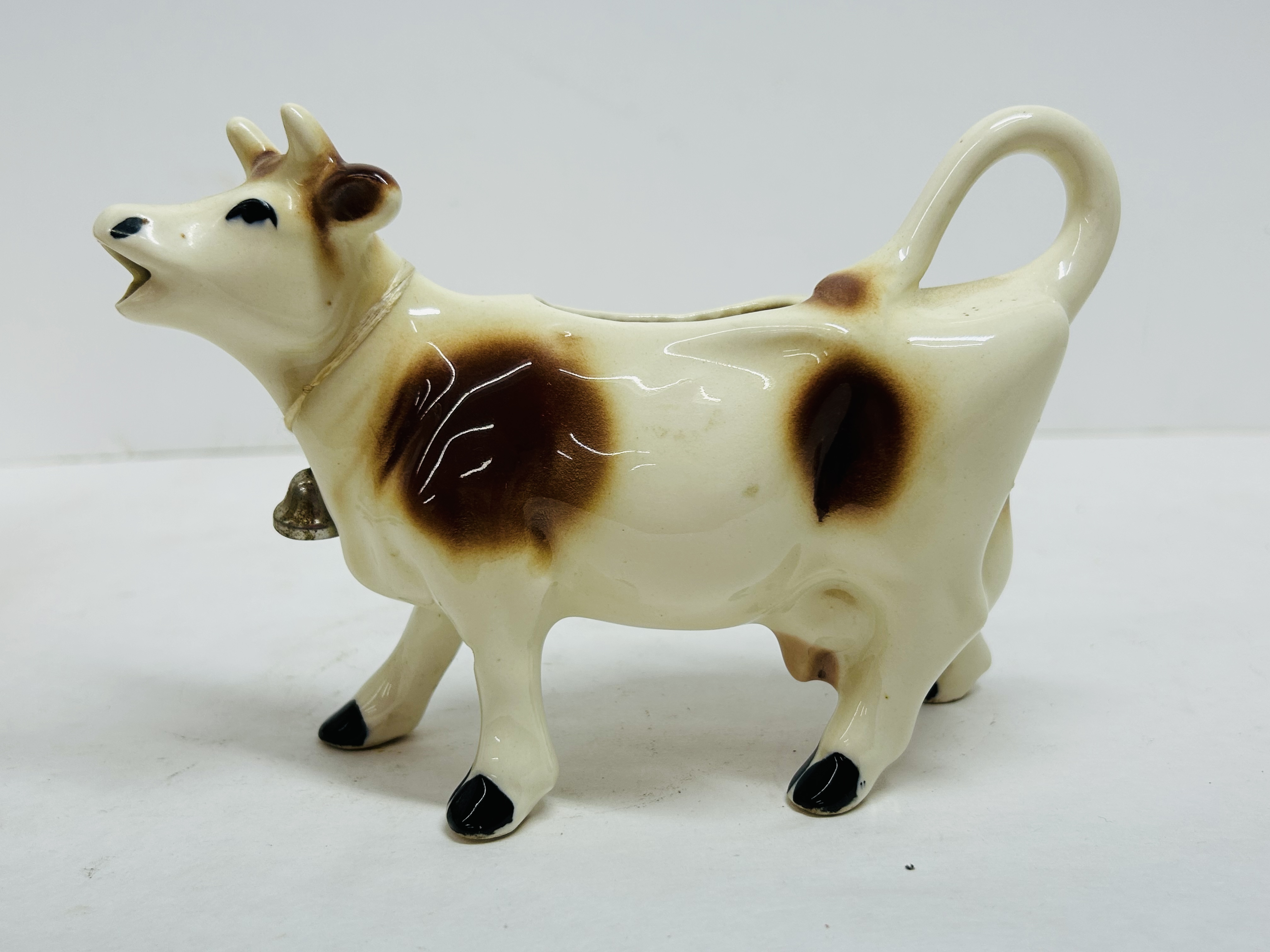 CERAMIC COW CREAMER PAIR, MID-20TH CENTURY