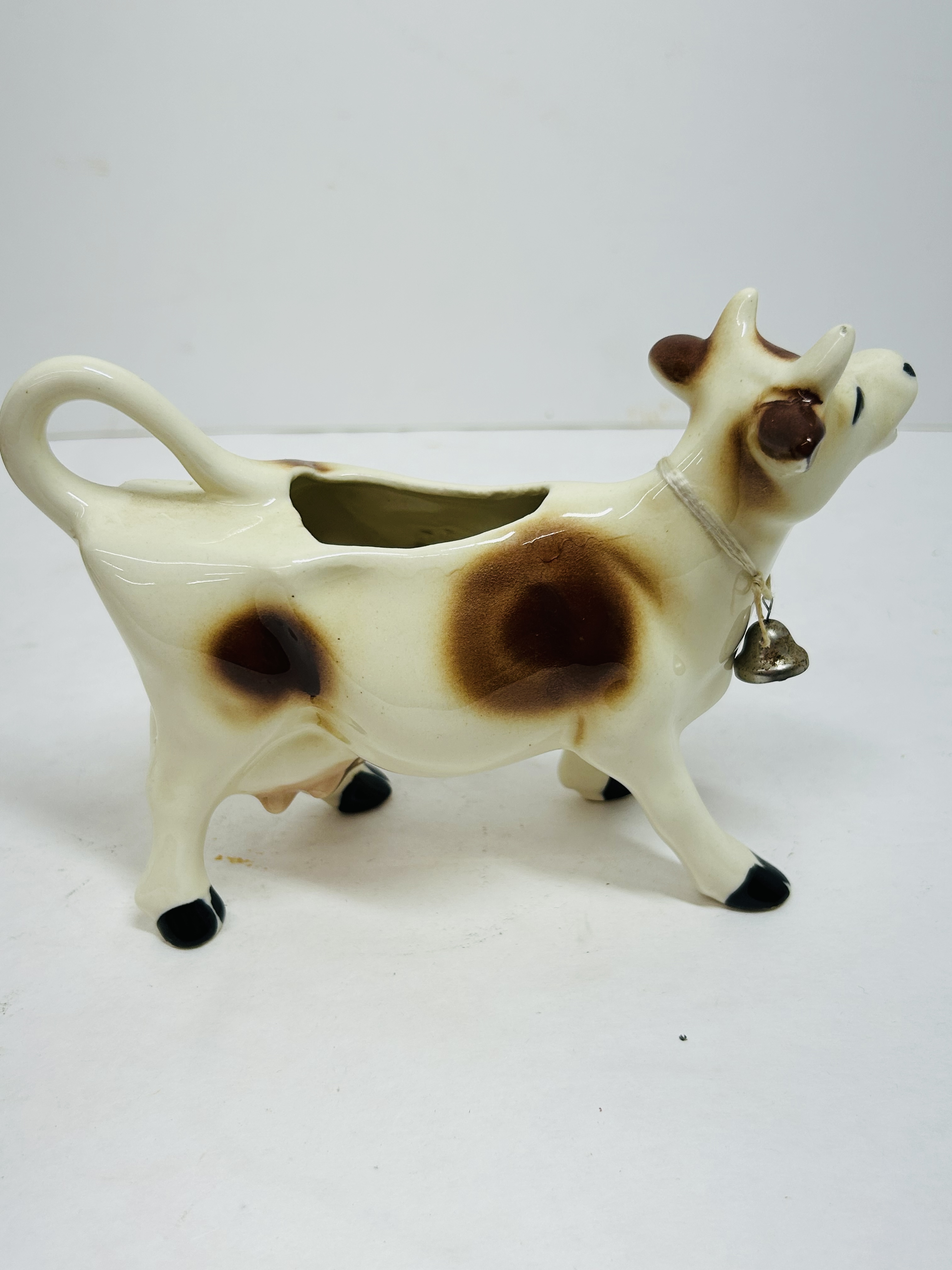 CERAMIC COW CREAMER PAIR, MID-20TH CENTURY