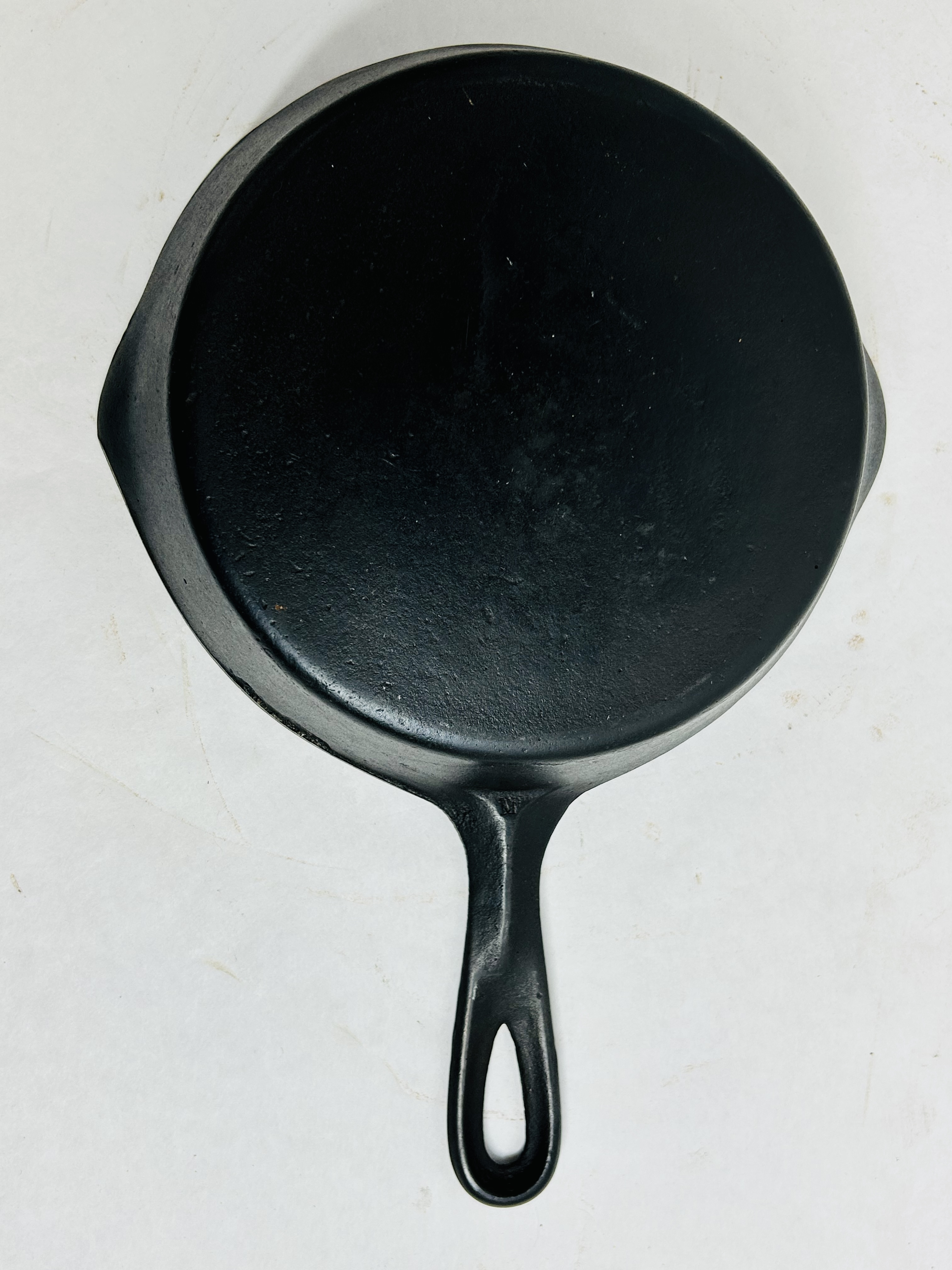CAST IRON SKILLET MARKED M, MID-20TH CENTURY