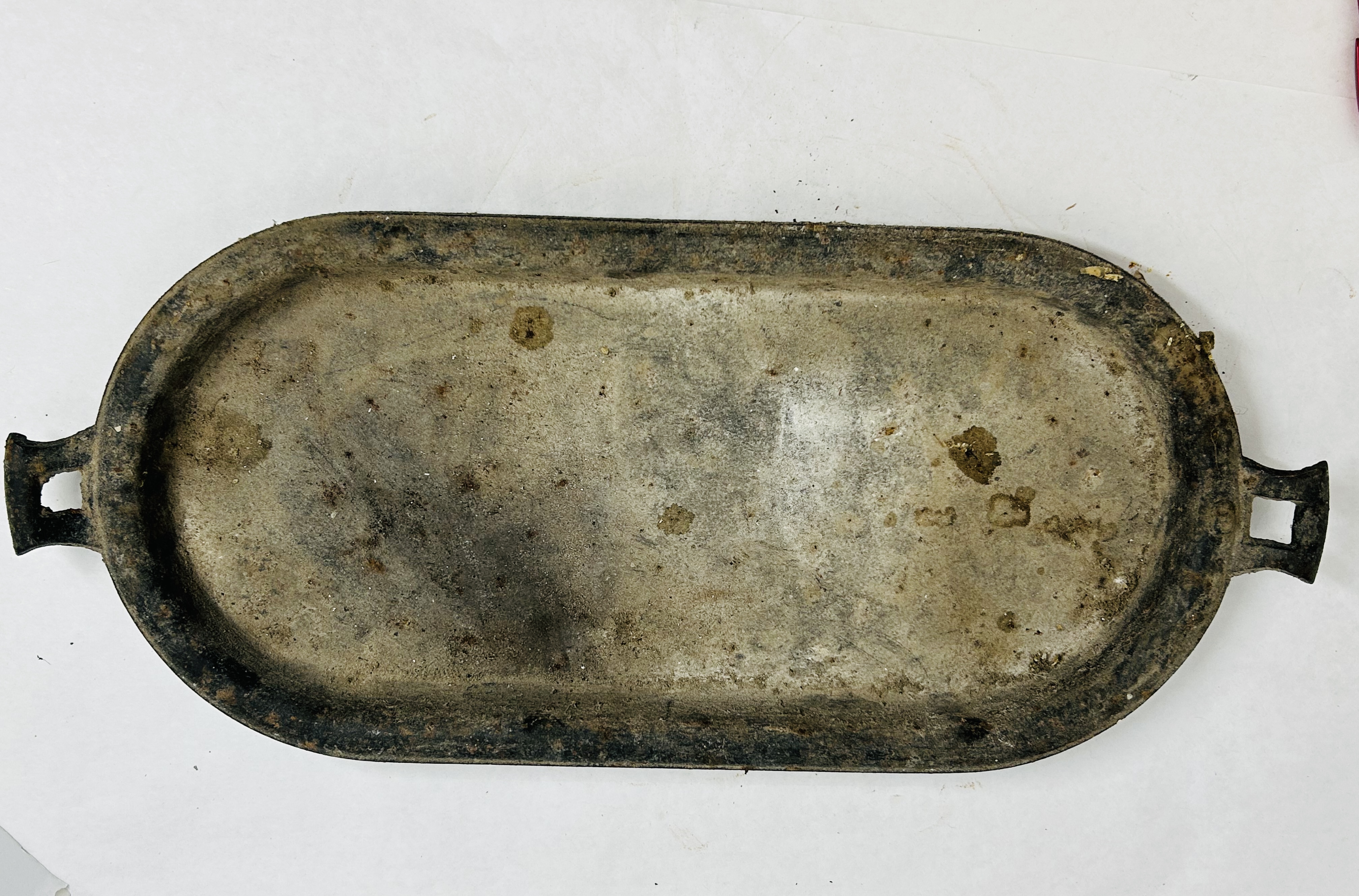 CAST IRON OVAL GRIDDLE, 19TH CENTURY