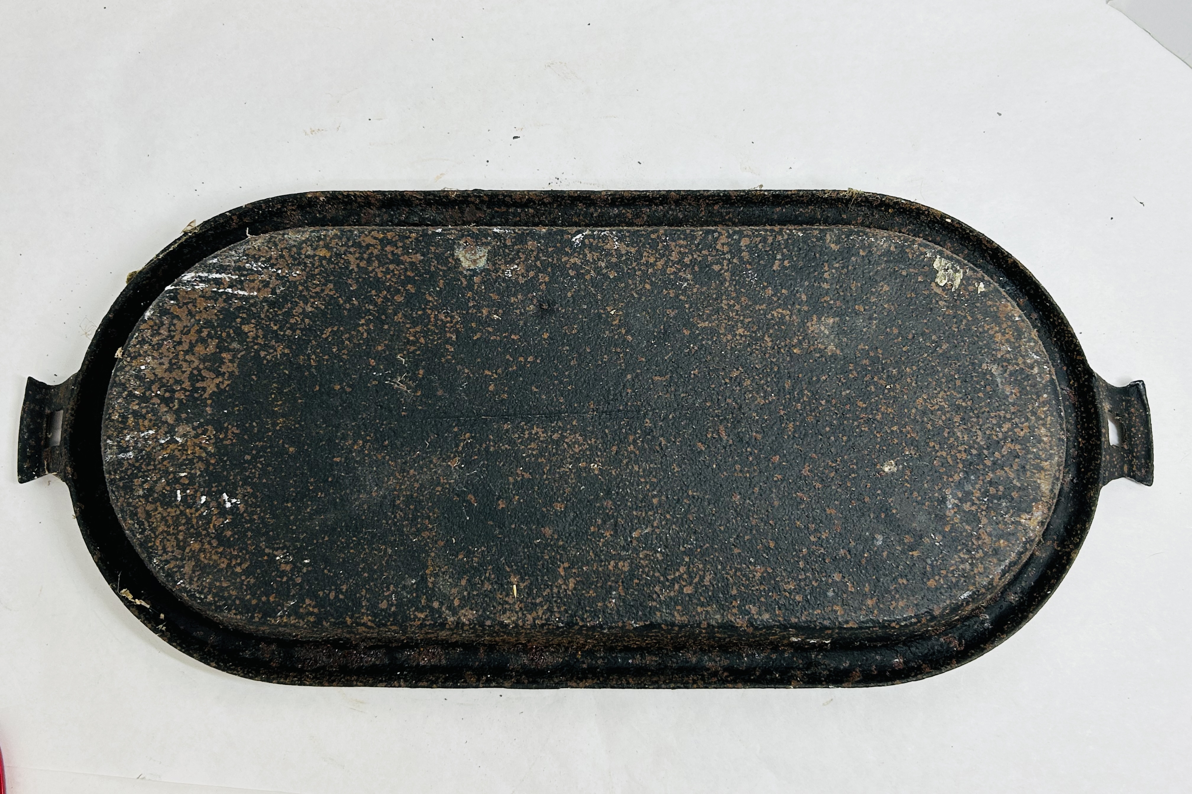 CAST IRON OVAL GRIDDLE, 19TH CENTURY