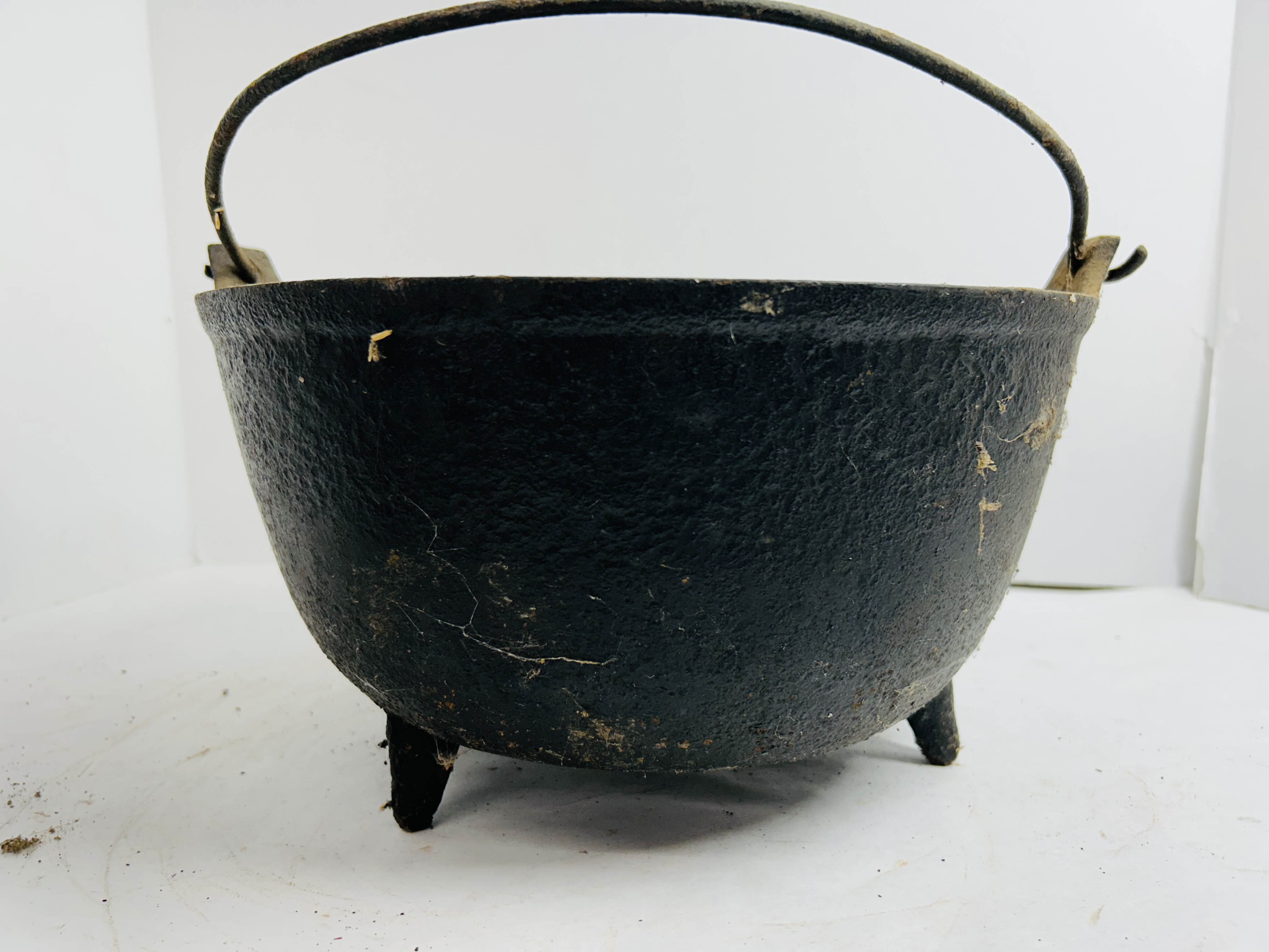 ANTIQUE CAST IRON THREE-LEGGED CAULDRON