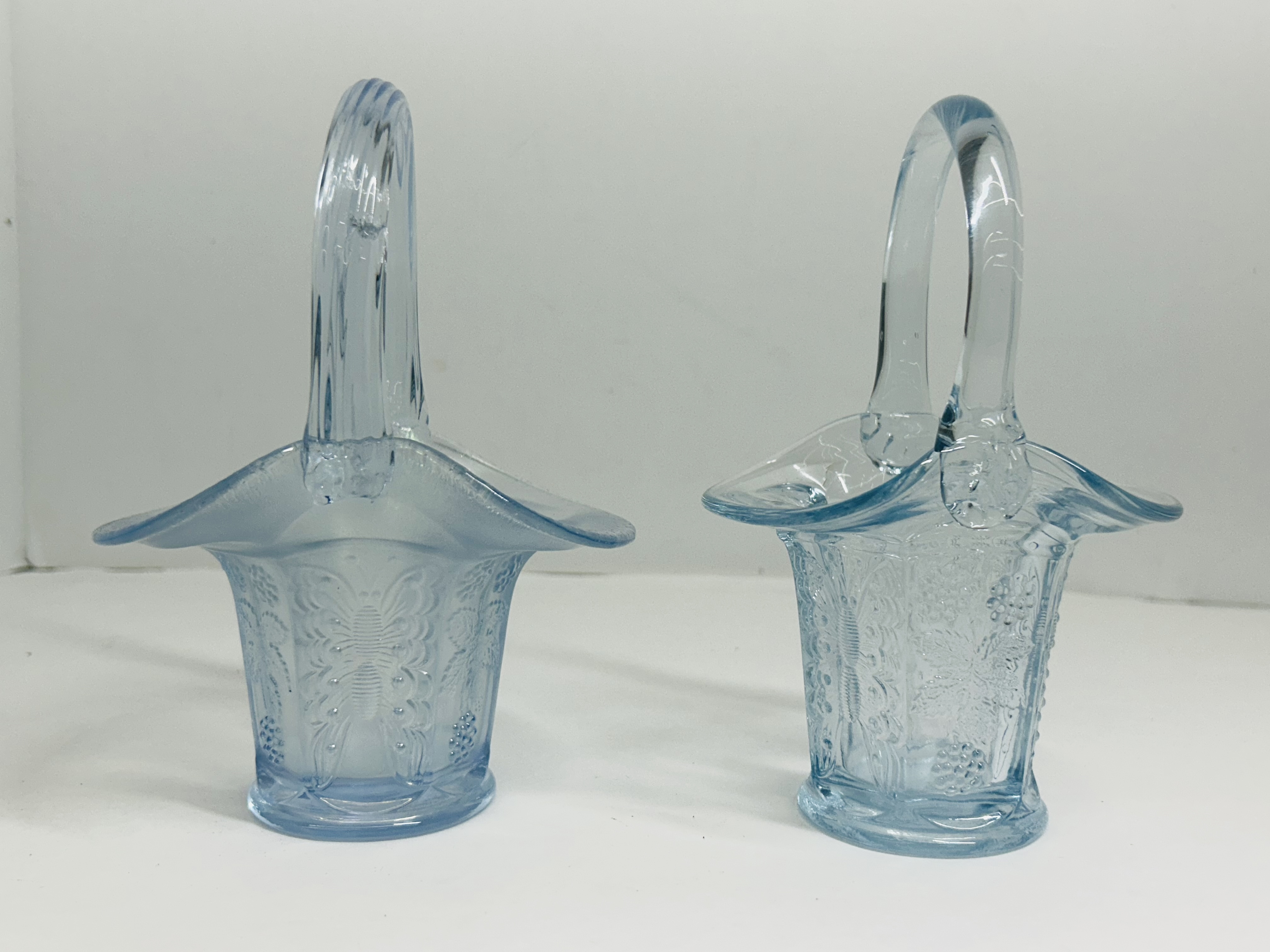 PAIR OF ATTRIBUTED FENTON GLASS BASKETS