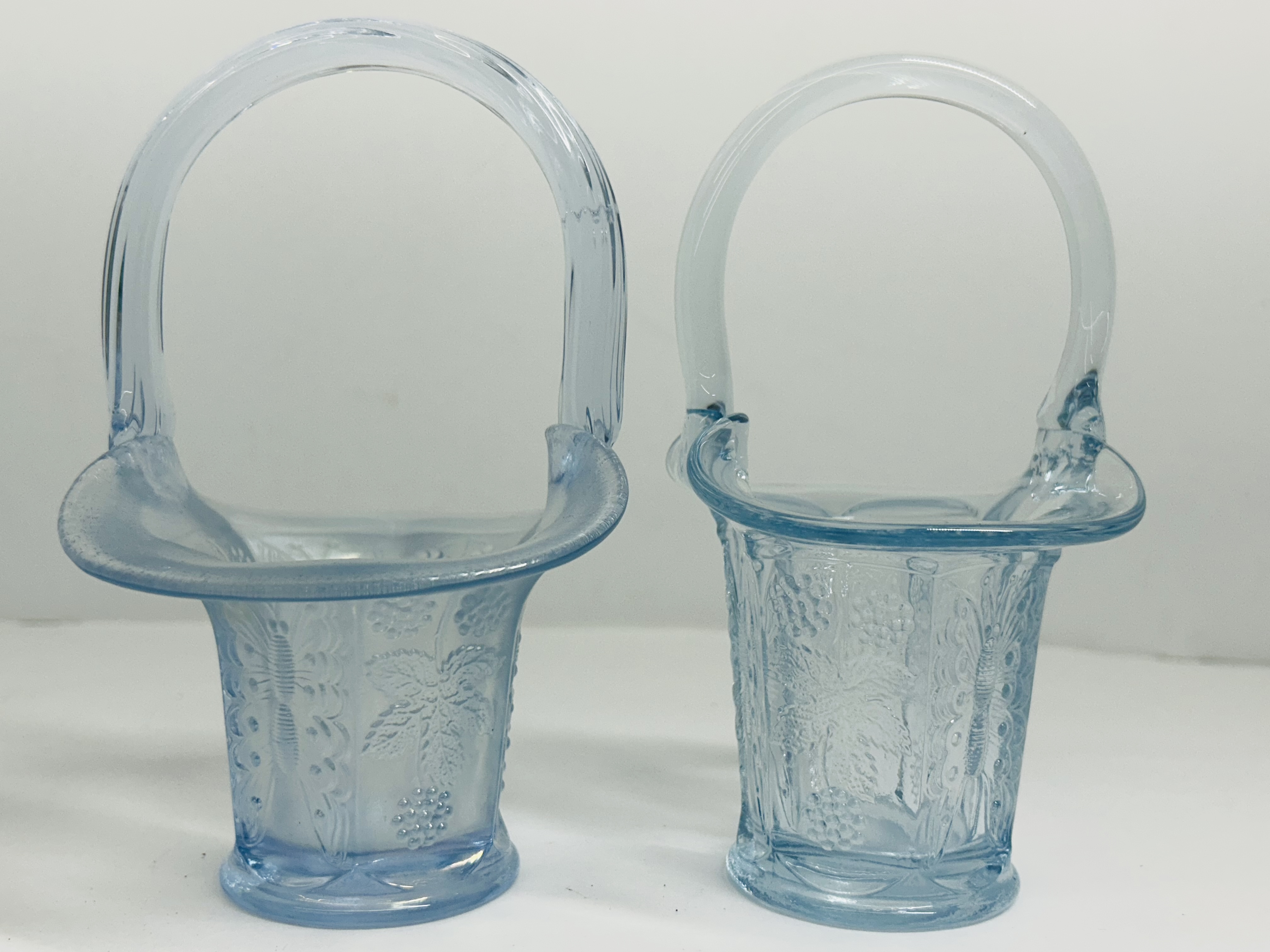 PAIR OF ATTRIBUTED FENTON GLASS BASKETS