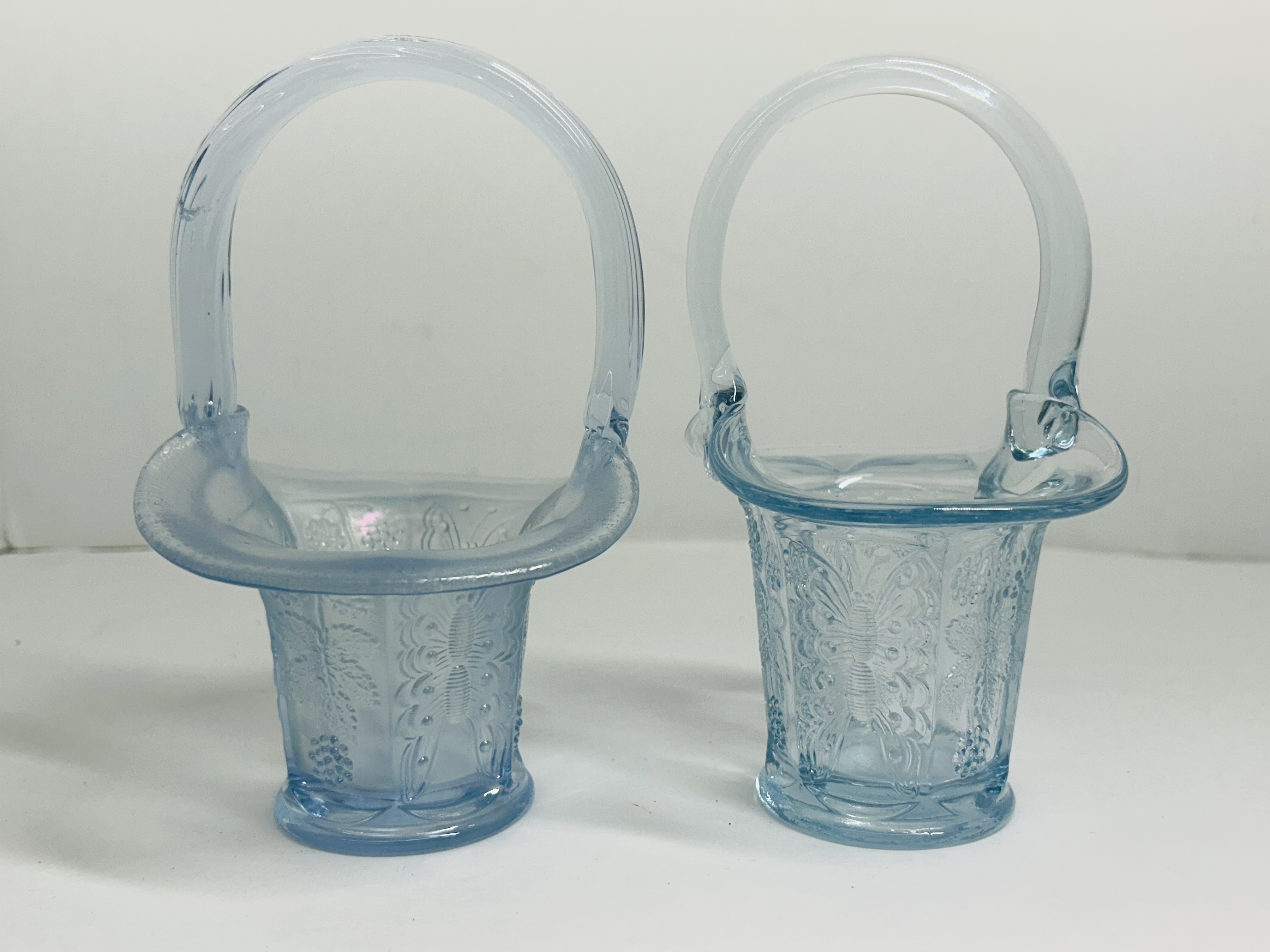 PAIR OF ATTRIBUTED FENTON GLASS BASKETS
