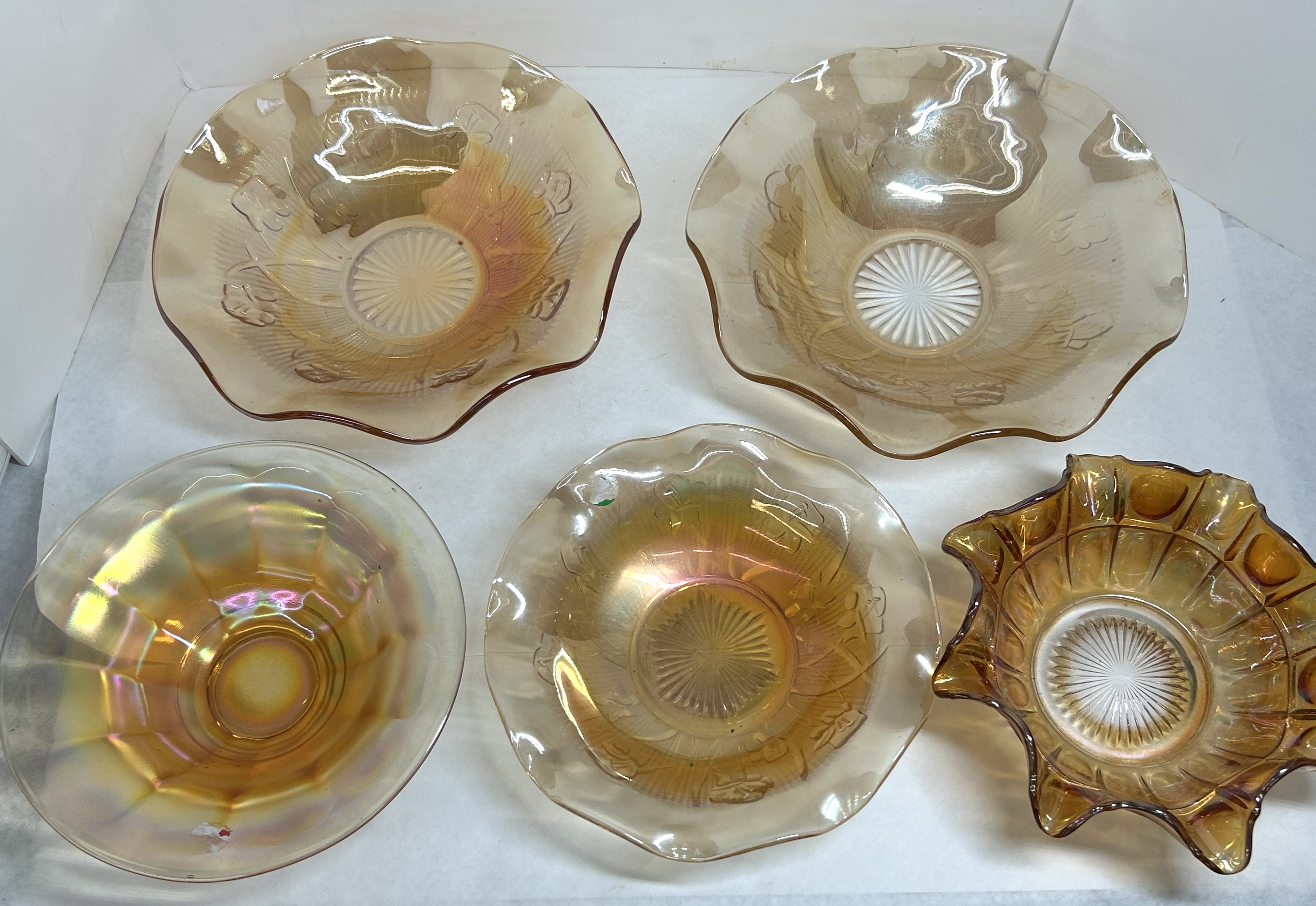 FIVE MARIGOLD IRIDESCENT GLASS BOWLS, C. 1930-1950