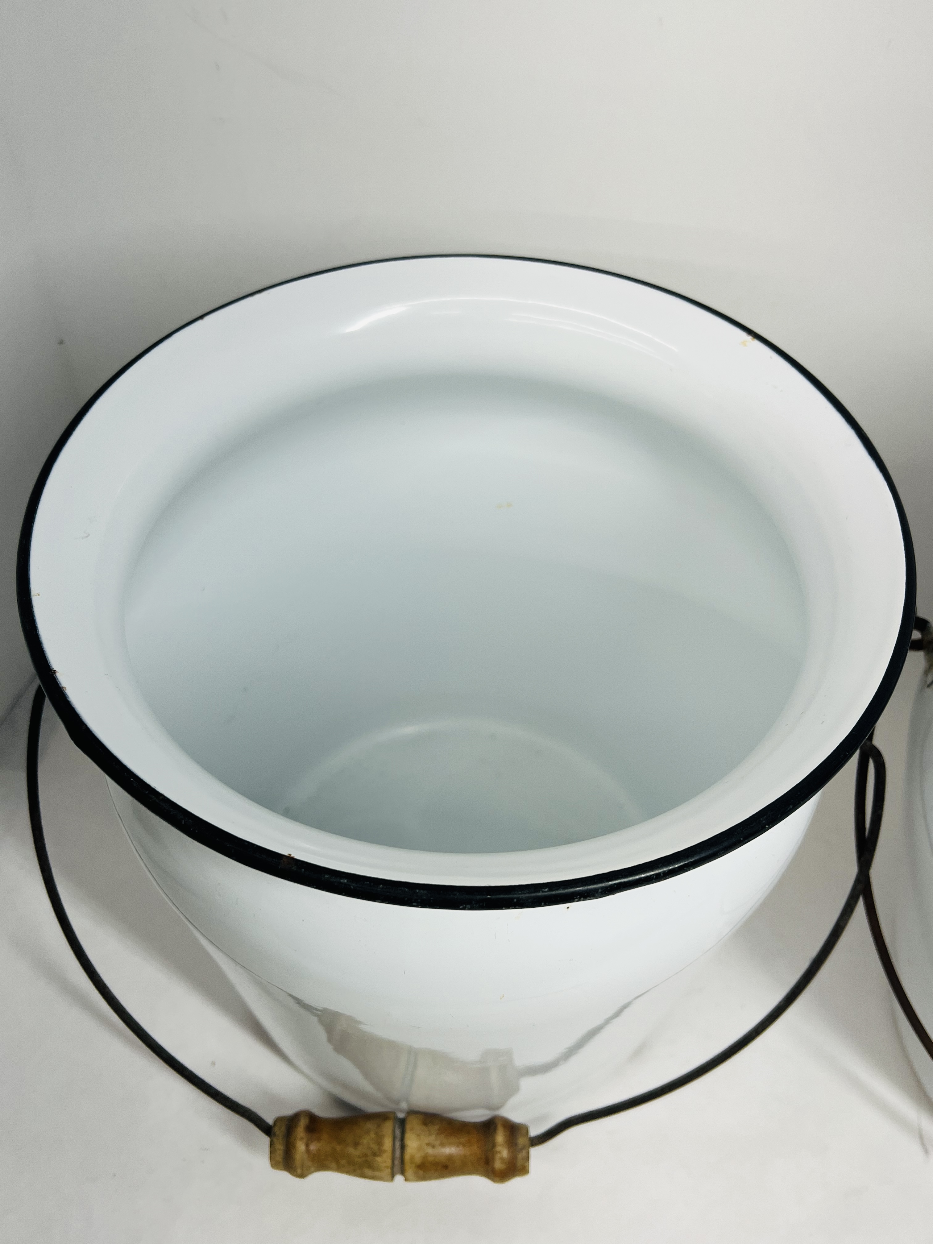TWO WHITE ENAMELWARE CHAMBER BUCKETS, CIRCA 1900