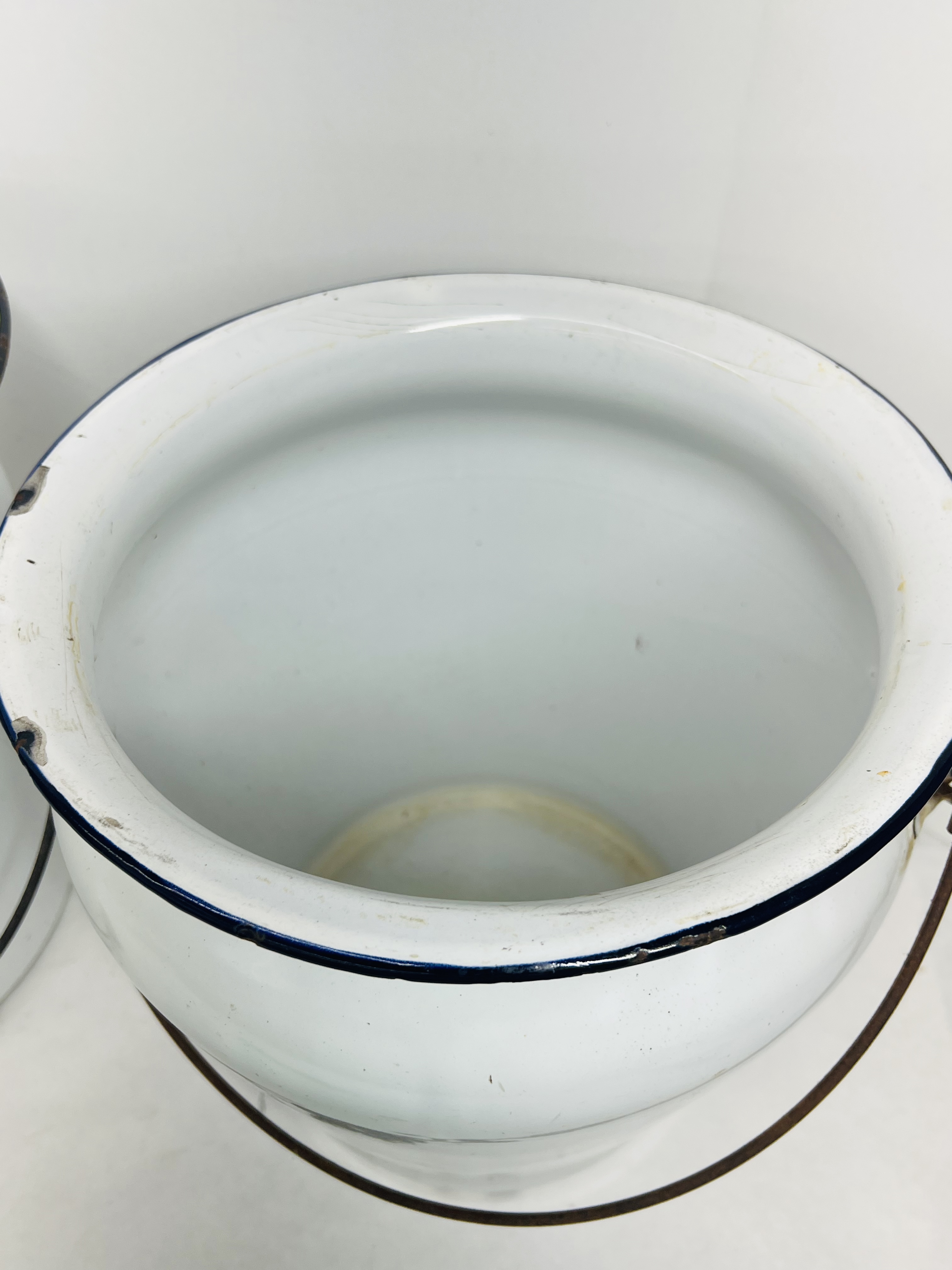 TWO WHITE ENAMELWARE CHAMBER BUCKETS, CIRCA 1900