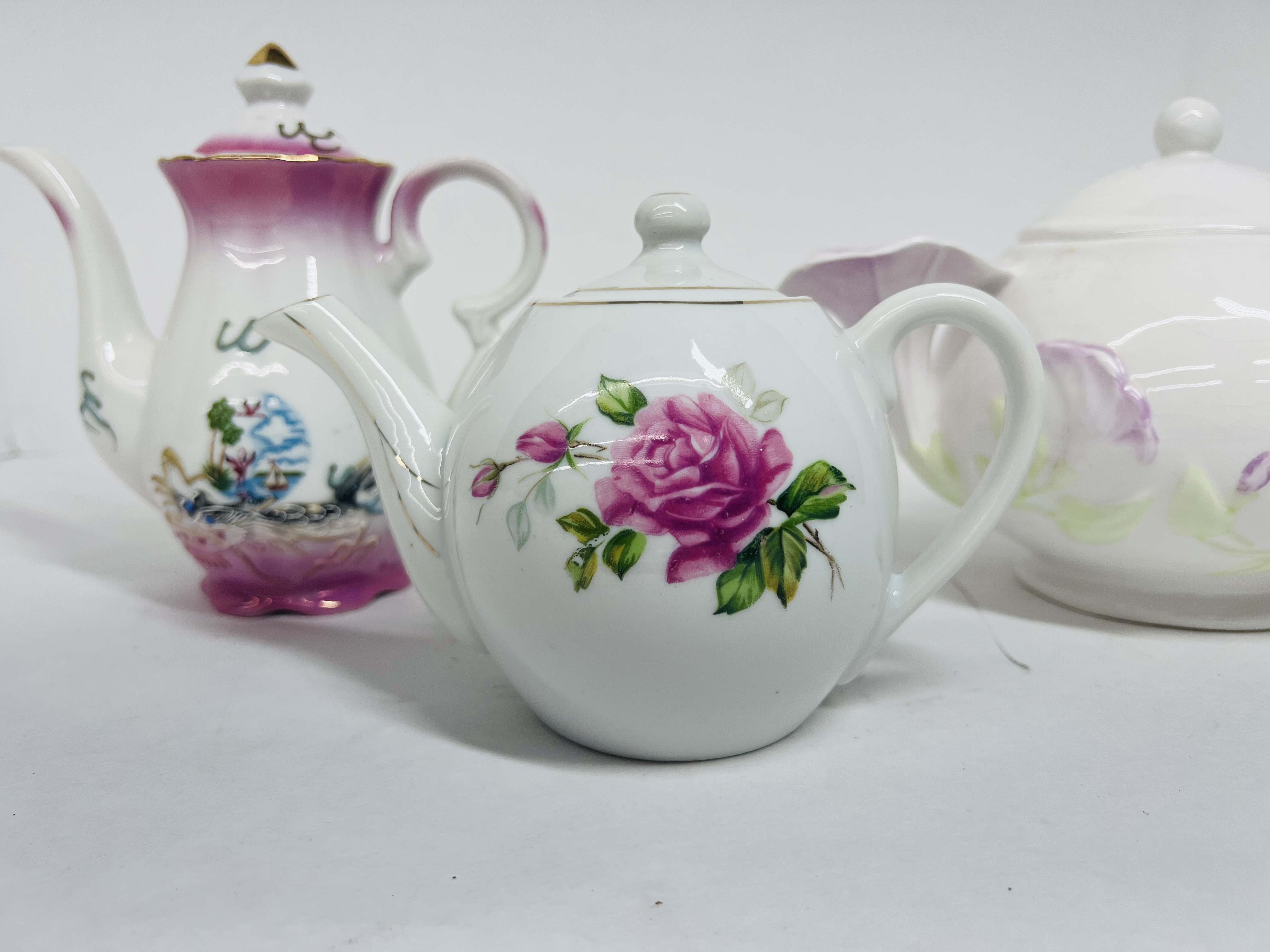 TRIO OF VINTAGE PORCELAIN TEAPOTS