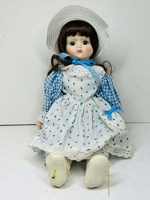 TAIWAN BISQUE PORCELAIN DOLL, 1990. Taiwan bisque porcelain collector doll featuring fixed blue 