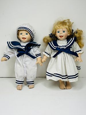 NAUTICAL DOLLS, LATE 20TH CENTURY. Nautical-themed pair of collectible dolls featuring molded 