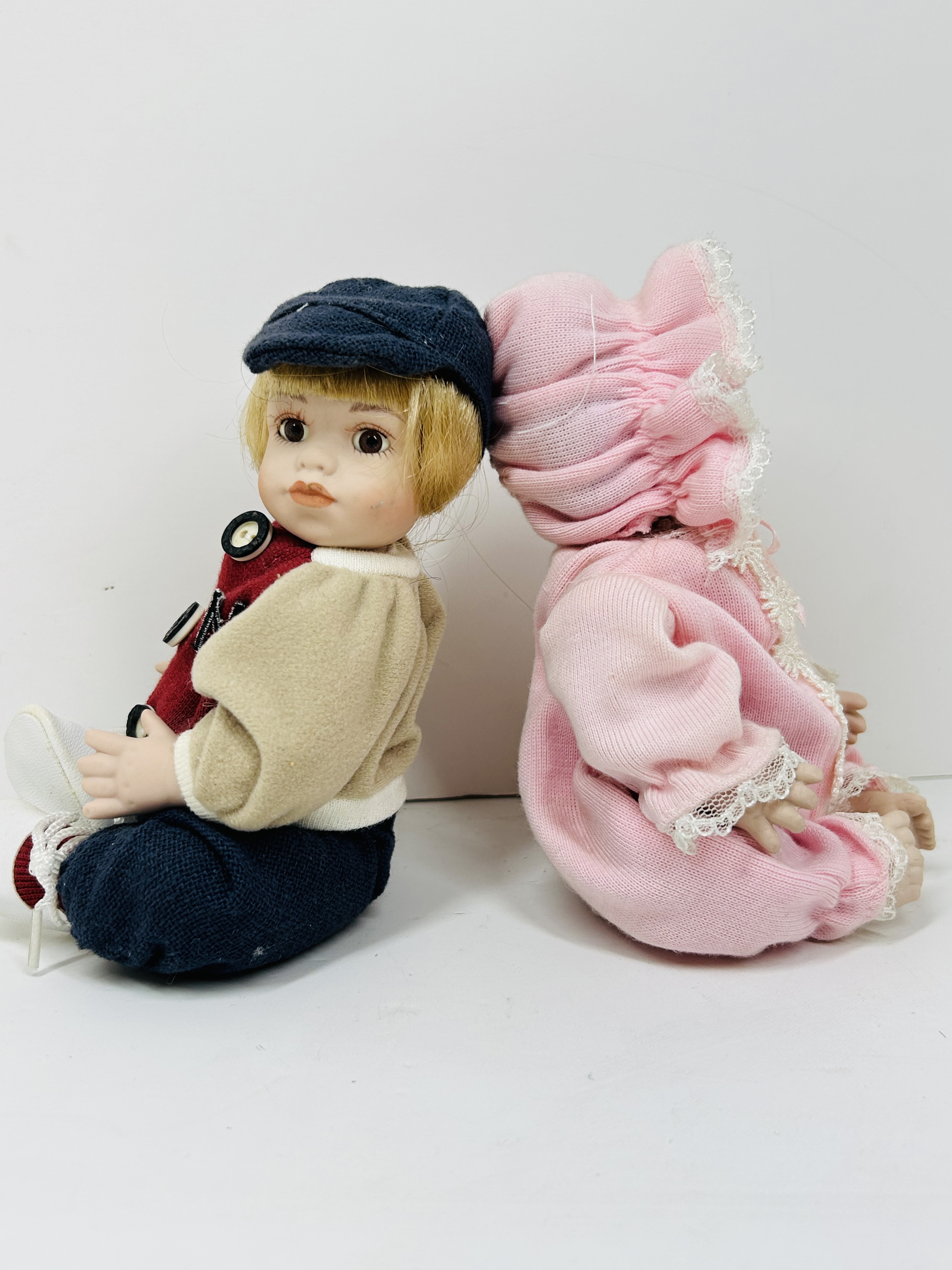 PAIR OF THEMED BISQUE DOLLS