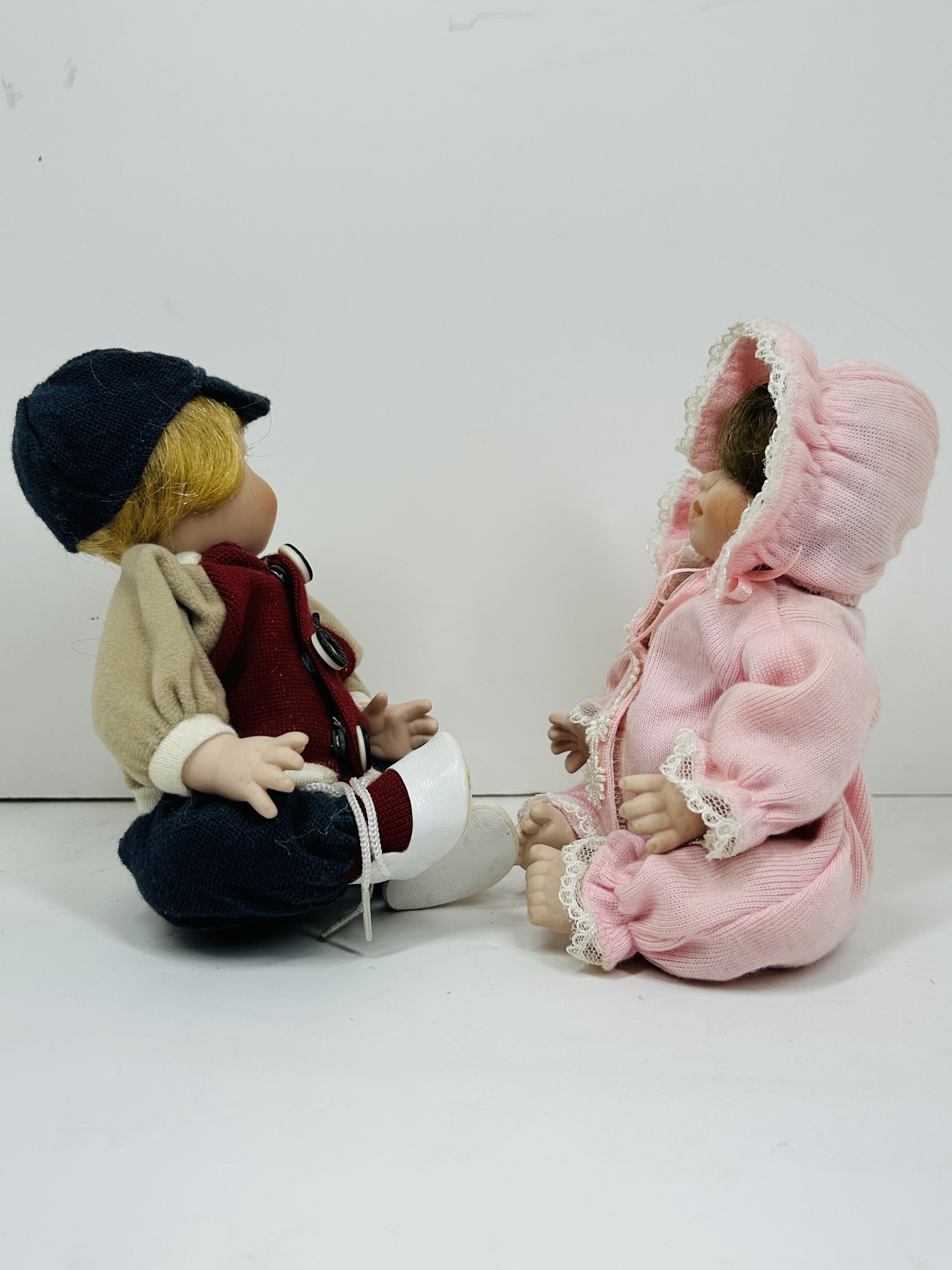 PAIR OF THEMED BISQUE DOLLS