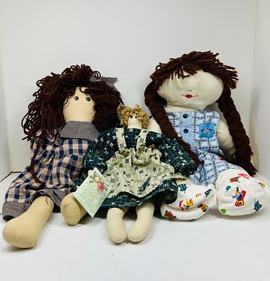 PURE COUNTRY CLOTH DOLLS VINTAGE. A trio of polyester fiber-filled cloth dolls manufactured by 