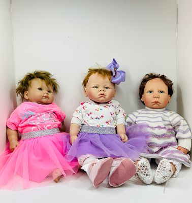 LINDA WEBB AND BERENGUER VINYL DOLLS. A trio of collectible baby dolls featuring two designs by 
