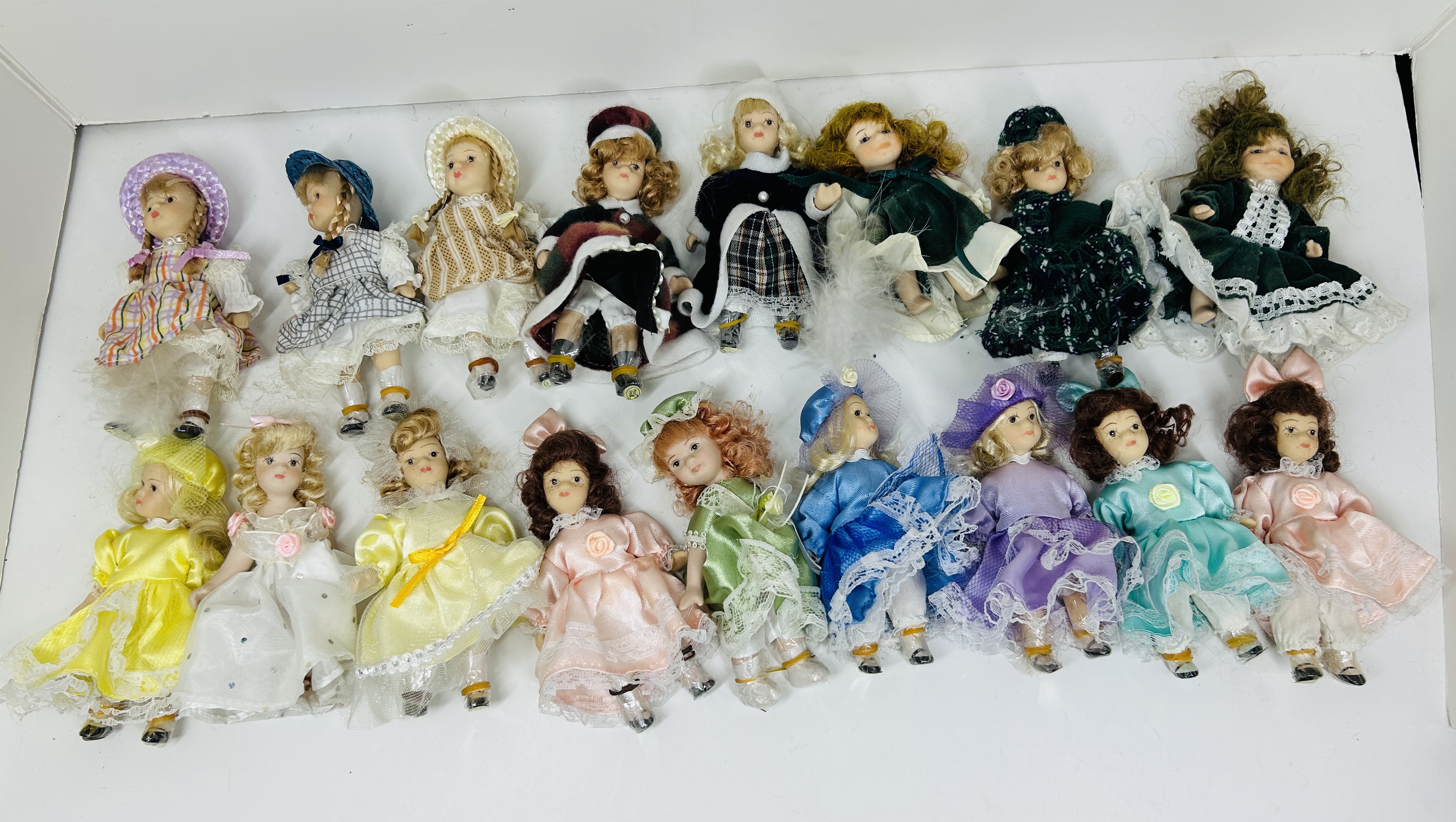 SEVENTEEN PORCELAIN COLLECTOR DOLLS, CIRCA 1990