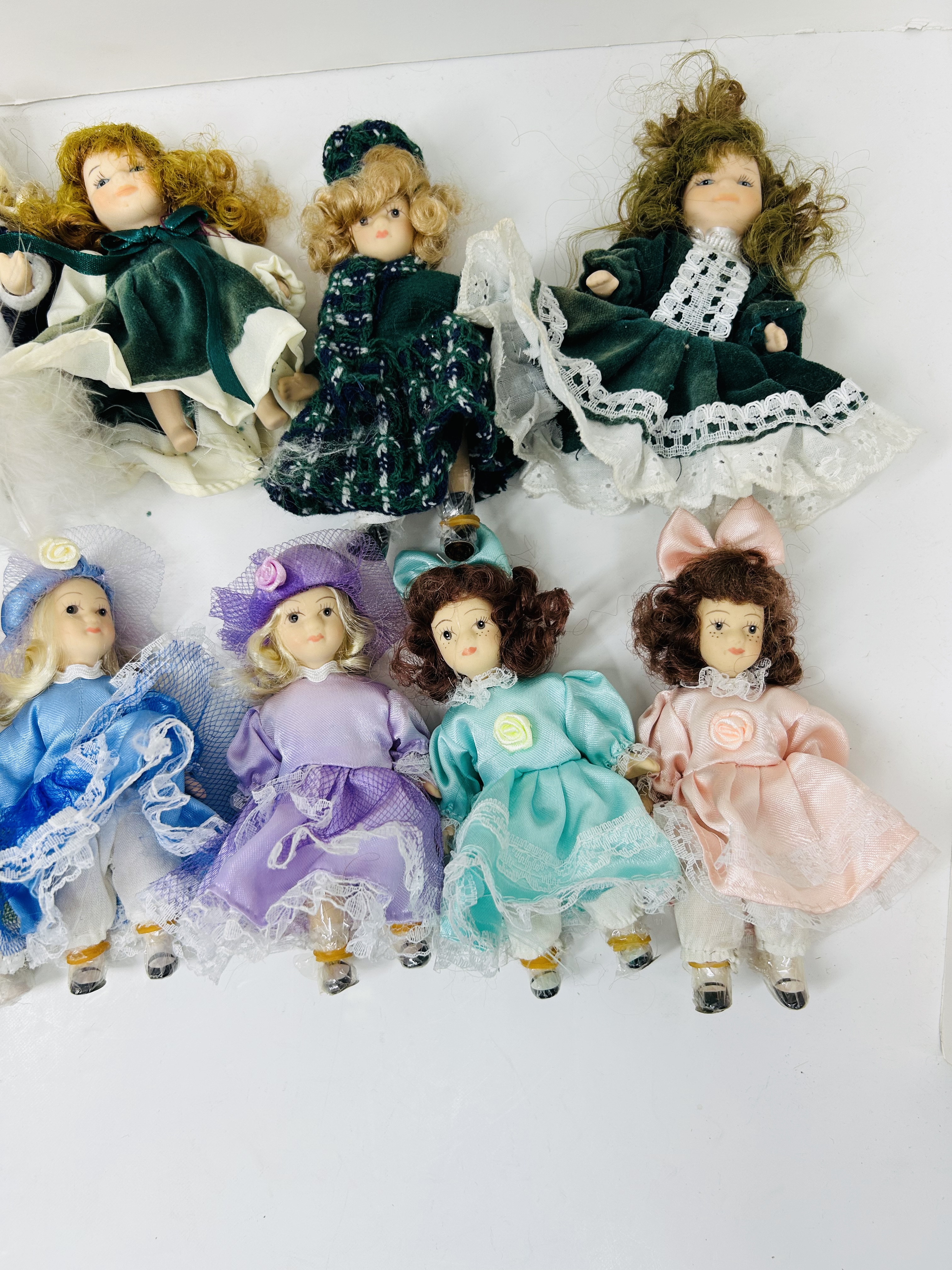 SEVENTEEN PORCELAIN COLLECTOR DOLLS, CIRCA 1990