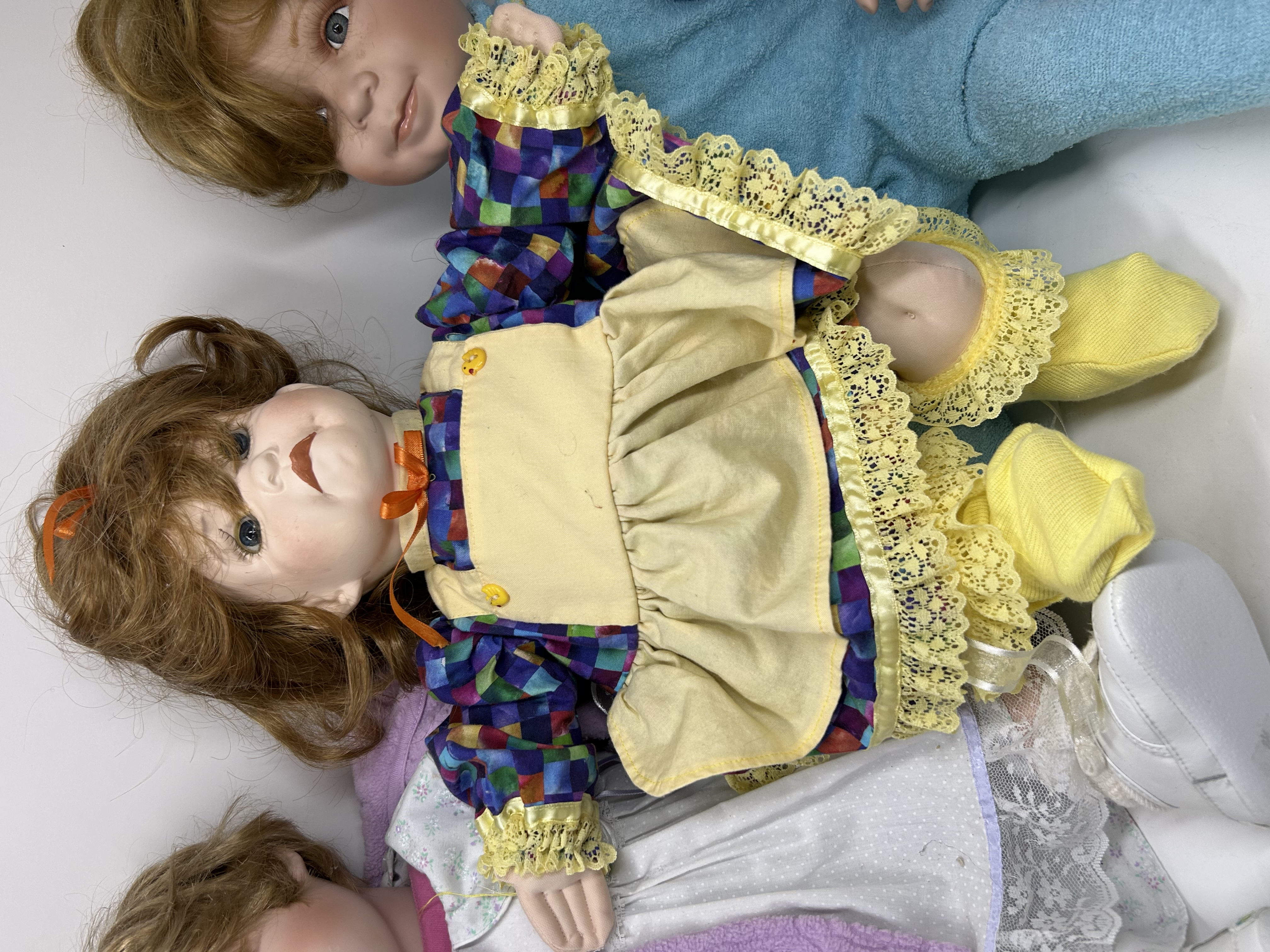 SWAN AND CATHAY PORCELAIN DOLLS, 20TH CENTURY
