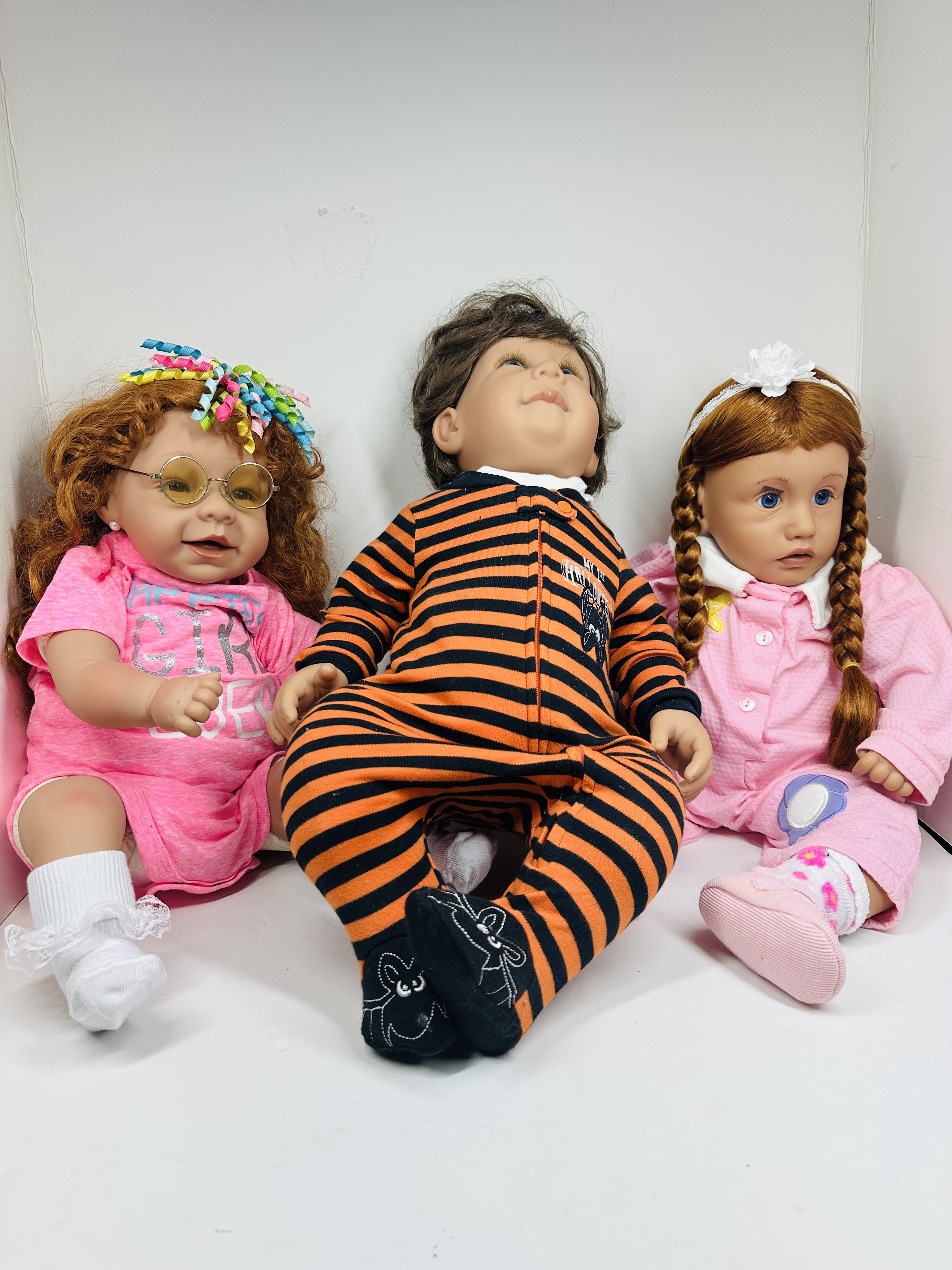 FIVE COLLECTIBLE VINYL AND CLOTH DOLLS