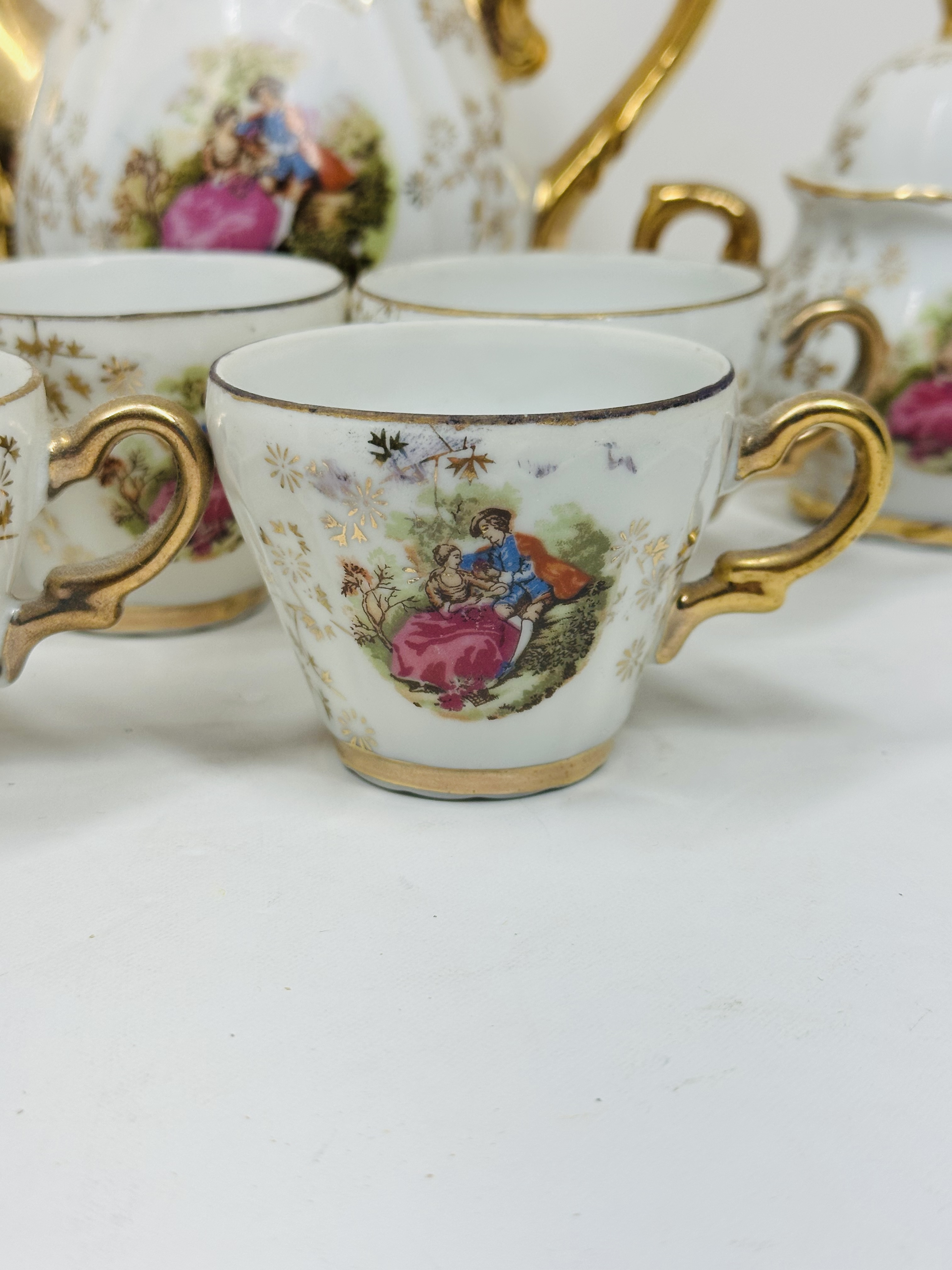 JAPANESE PORCELAIN 21-PIECE TEA SET, C. 1950