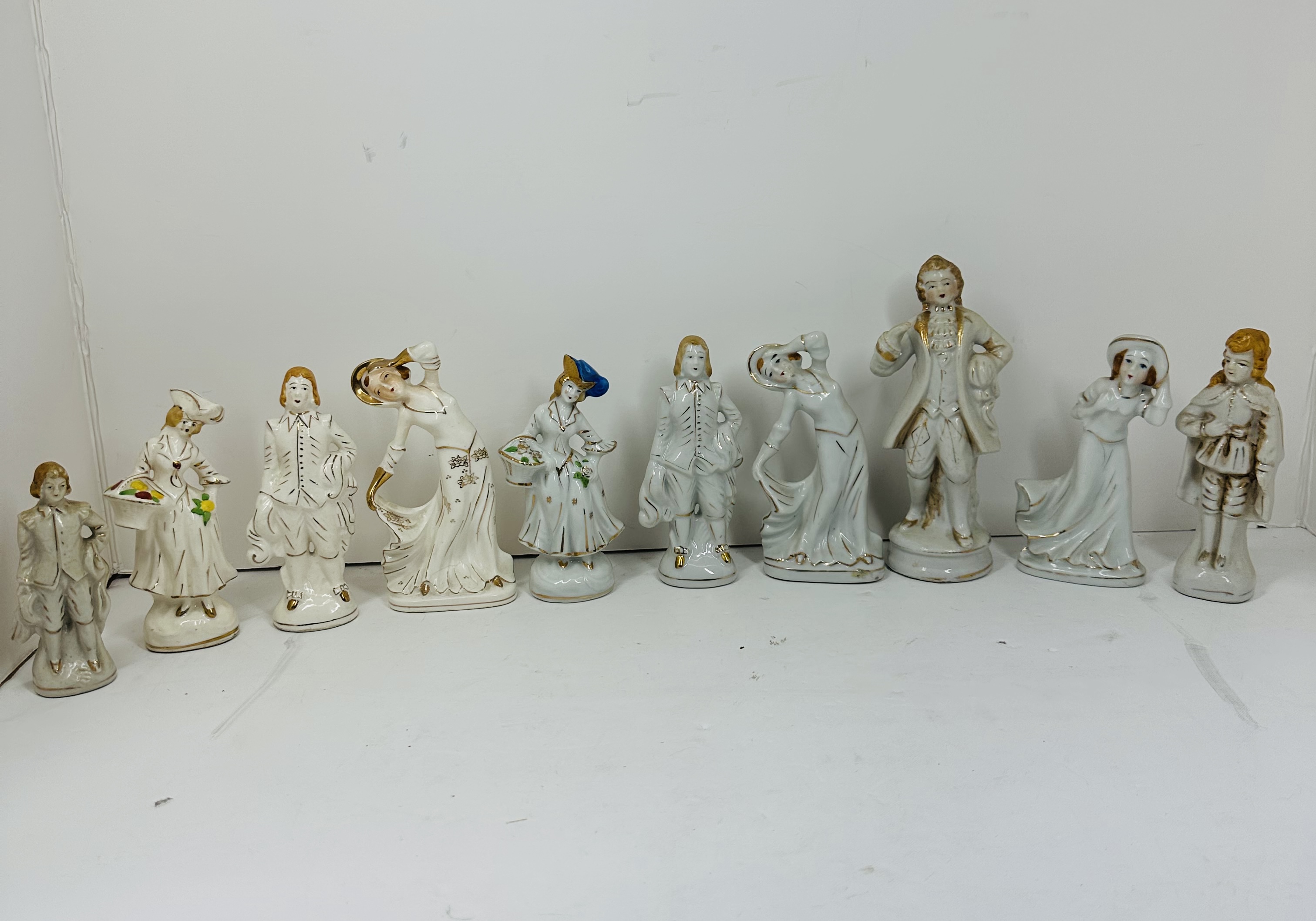 TEN GILT WHITE PORCELAIN FIGURINES, MID-20TH CENTURY