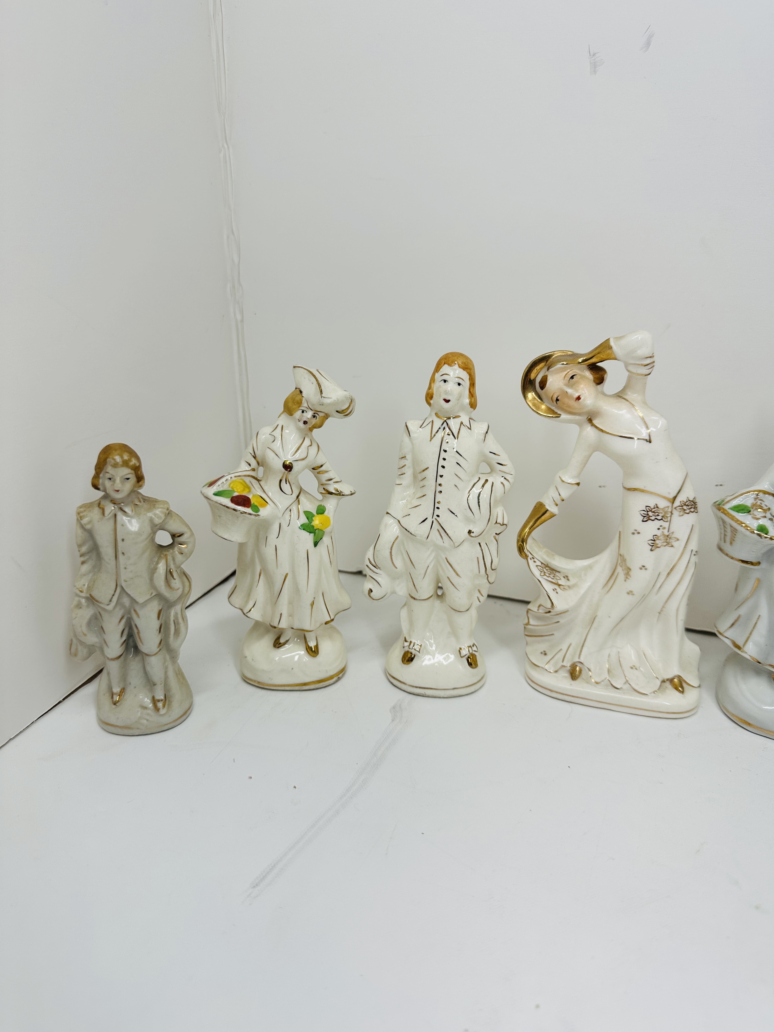 TEN GILT WHITE PORCELAIN FIGURINES, MID-20TH CENTURY