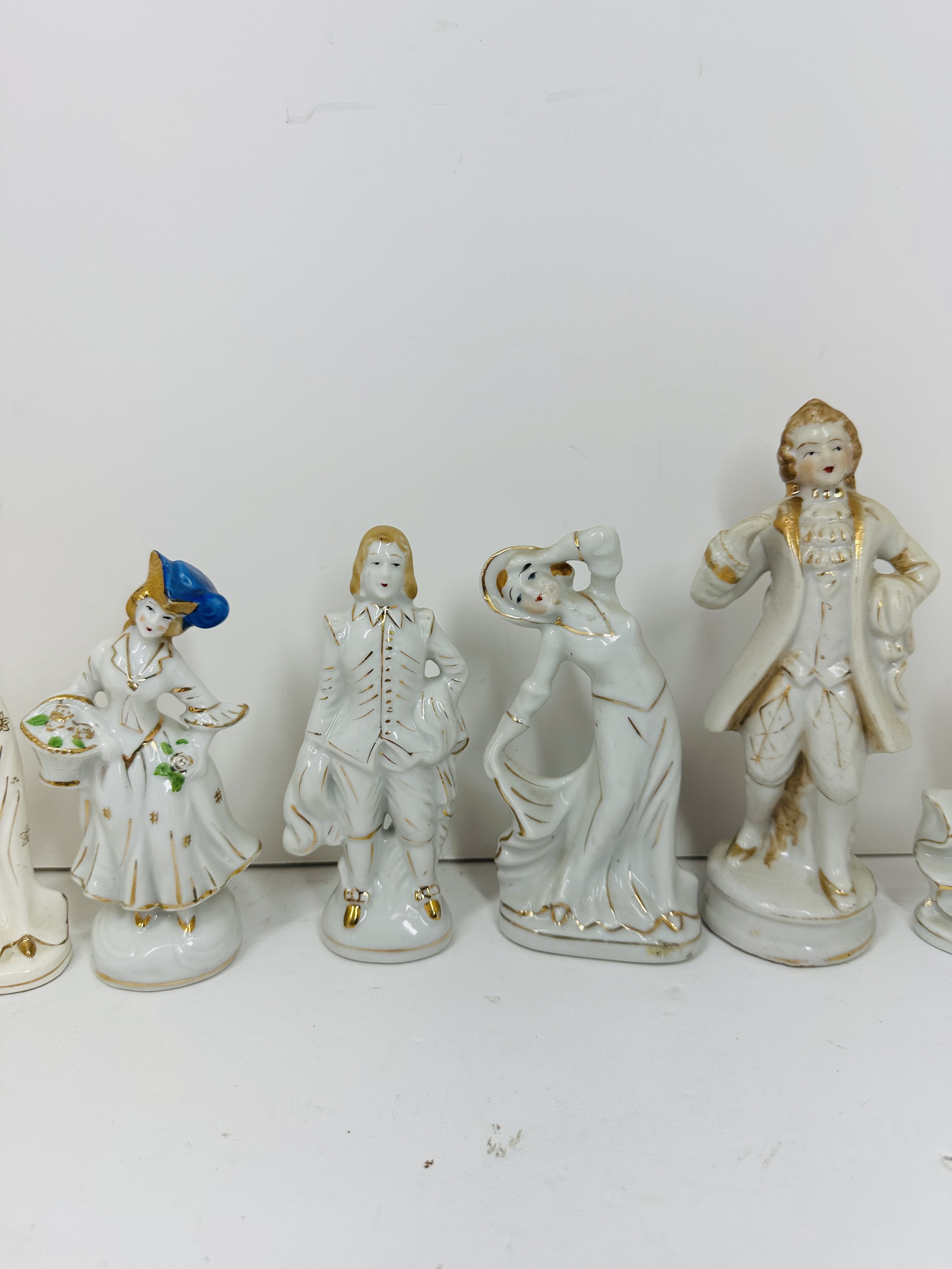 TEN GILT WHITE PORCELAIN FIGURINES, MID-20TH CENTURY