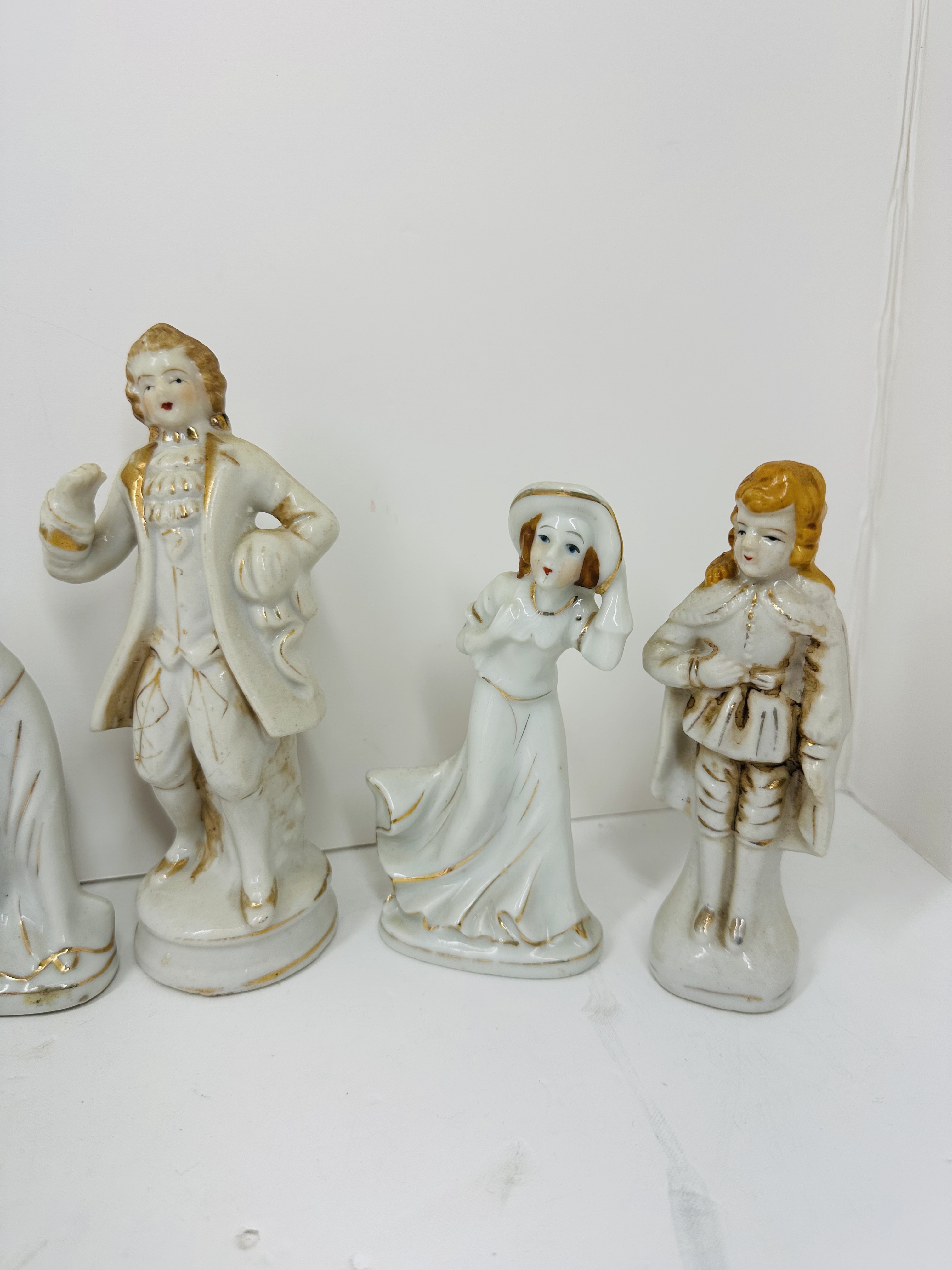 TEN GILT WHITE PORCELAIN FIGURINES, MID-20TH CENTURY