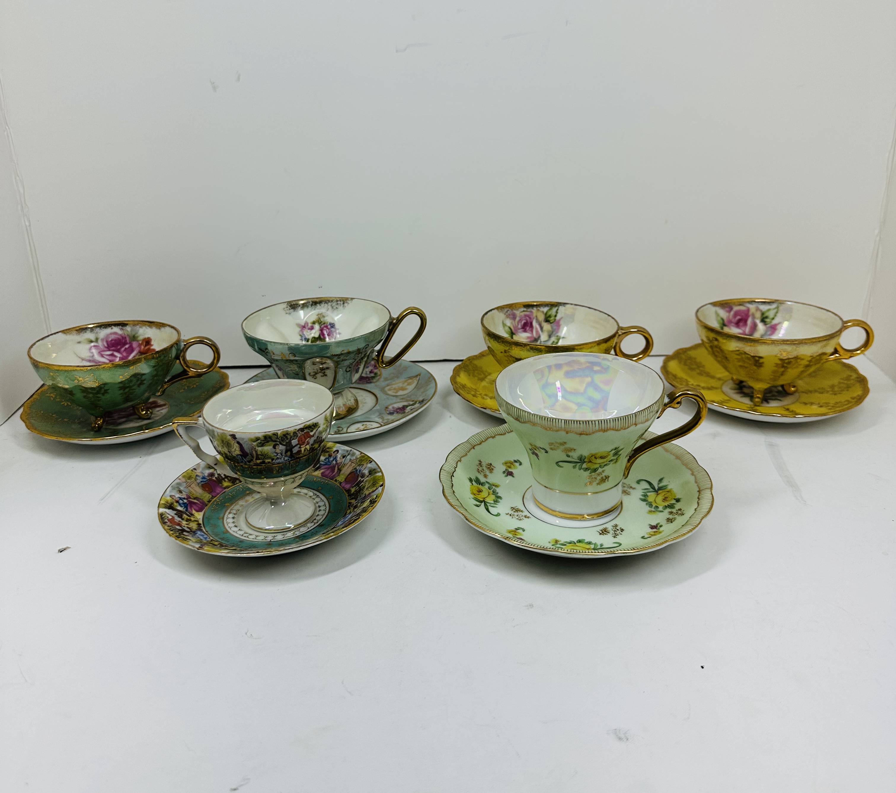 SIX PORCELAIN TEACUP SETS, CIRCA 1950
