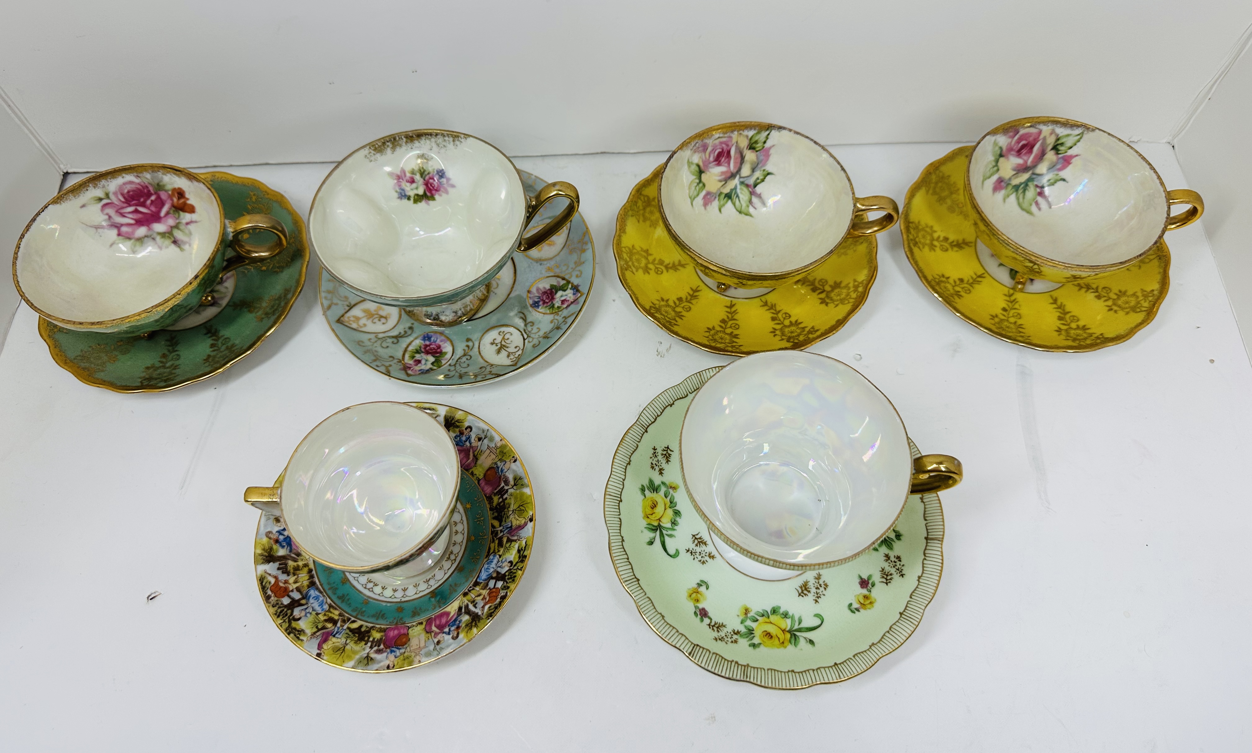 SIX PORCELAIN TEACUP SETS, CIRCA 1950