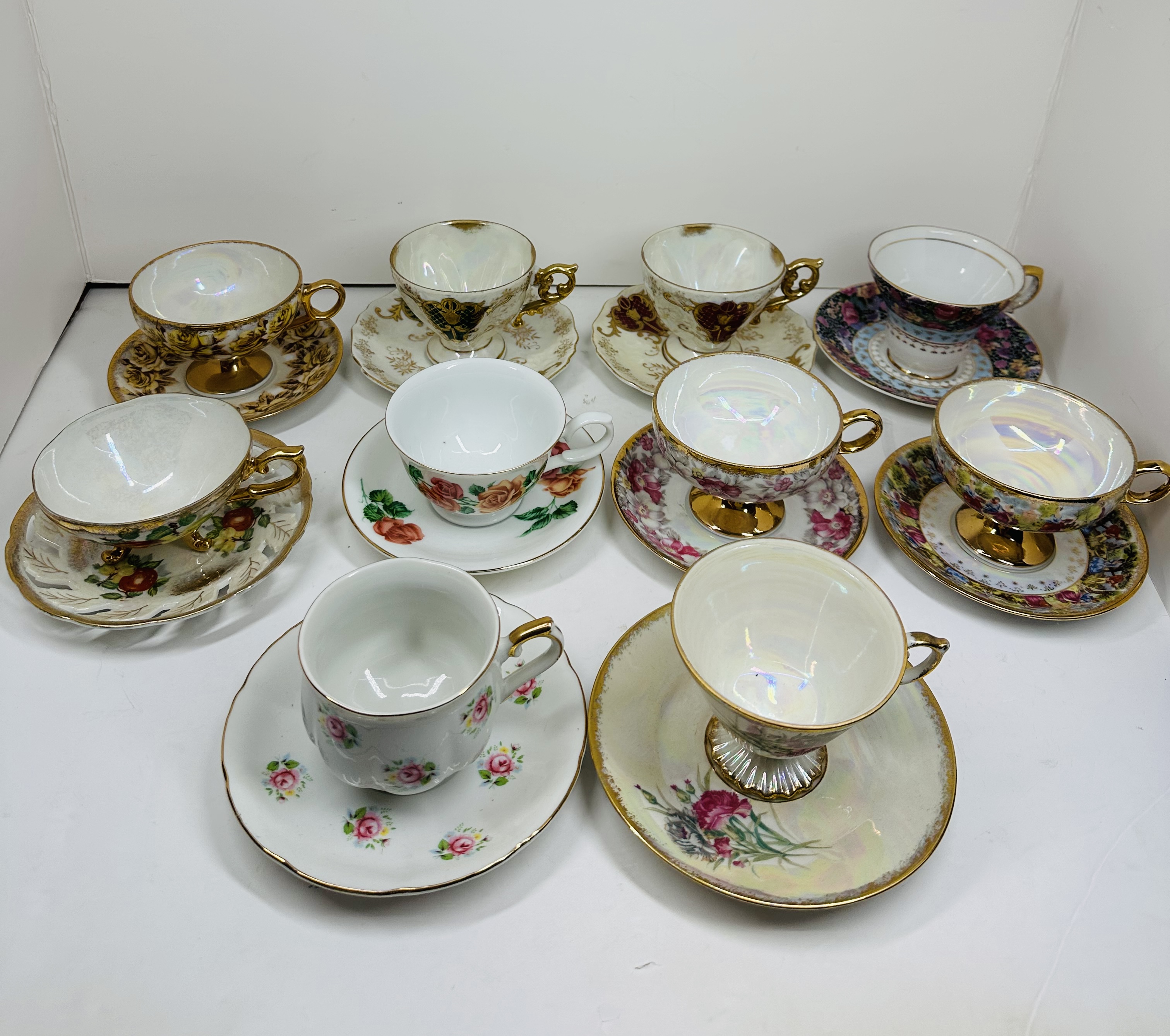 TEN PORCELAIN TEACUP SETS, MID-20TH CENTURY
