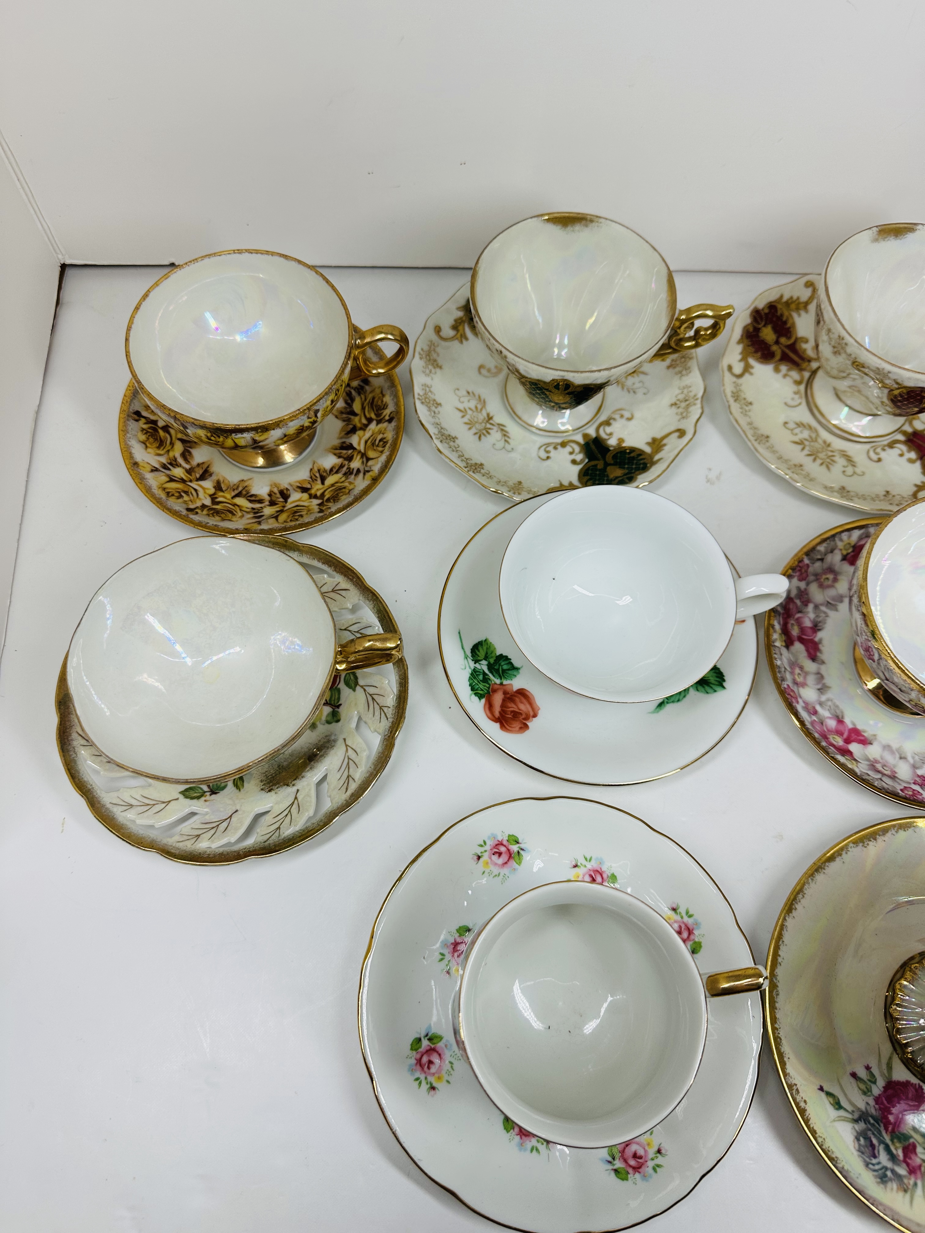 TEN PORCELAIN TEACUP SETS, MID-20TH CENTURY