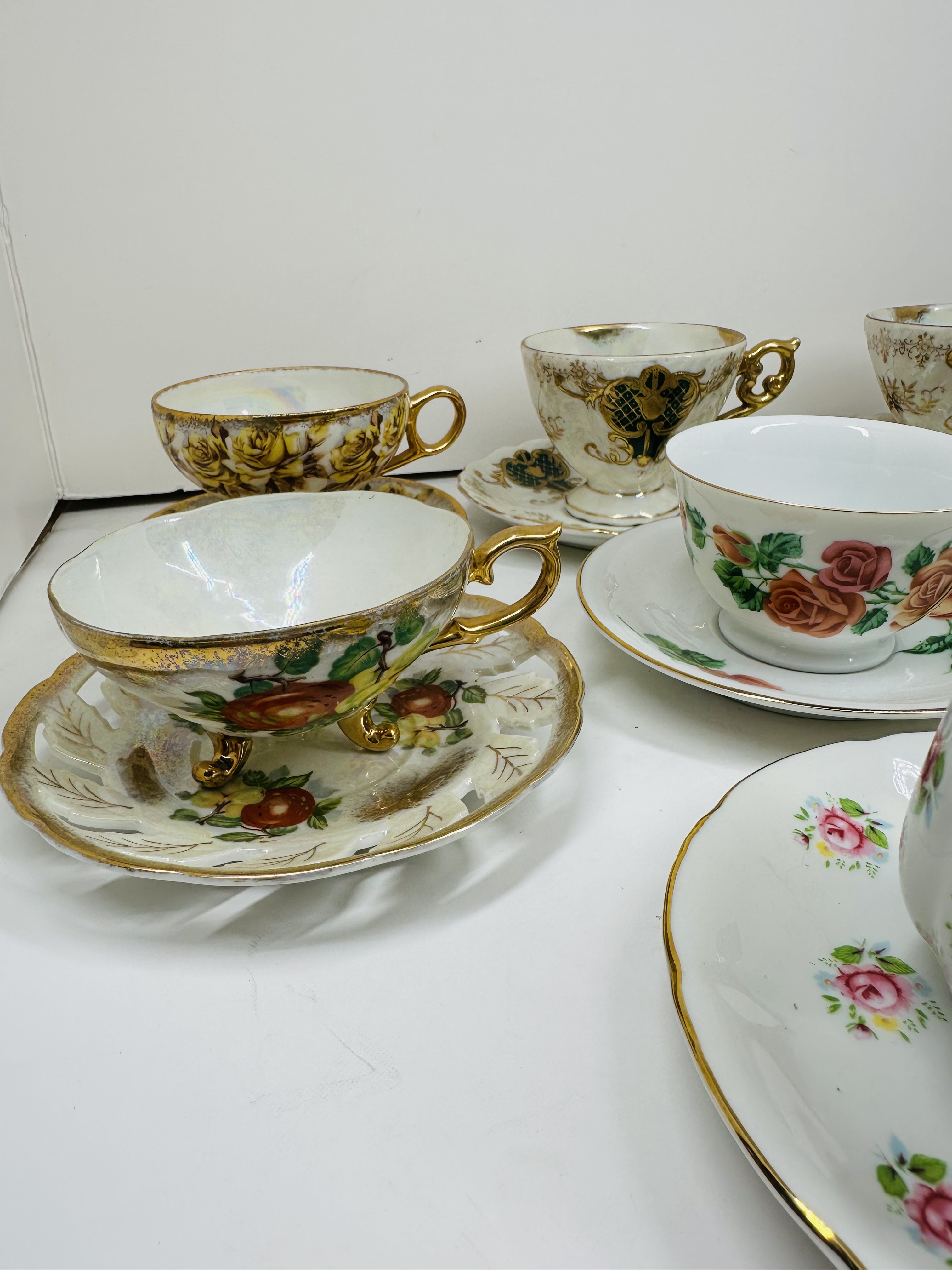 TEN PORCELAIN TEACUP SETS, MID-20TH CENTURY
