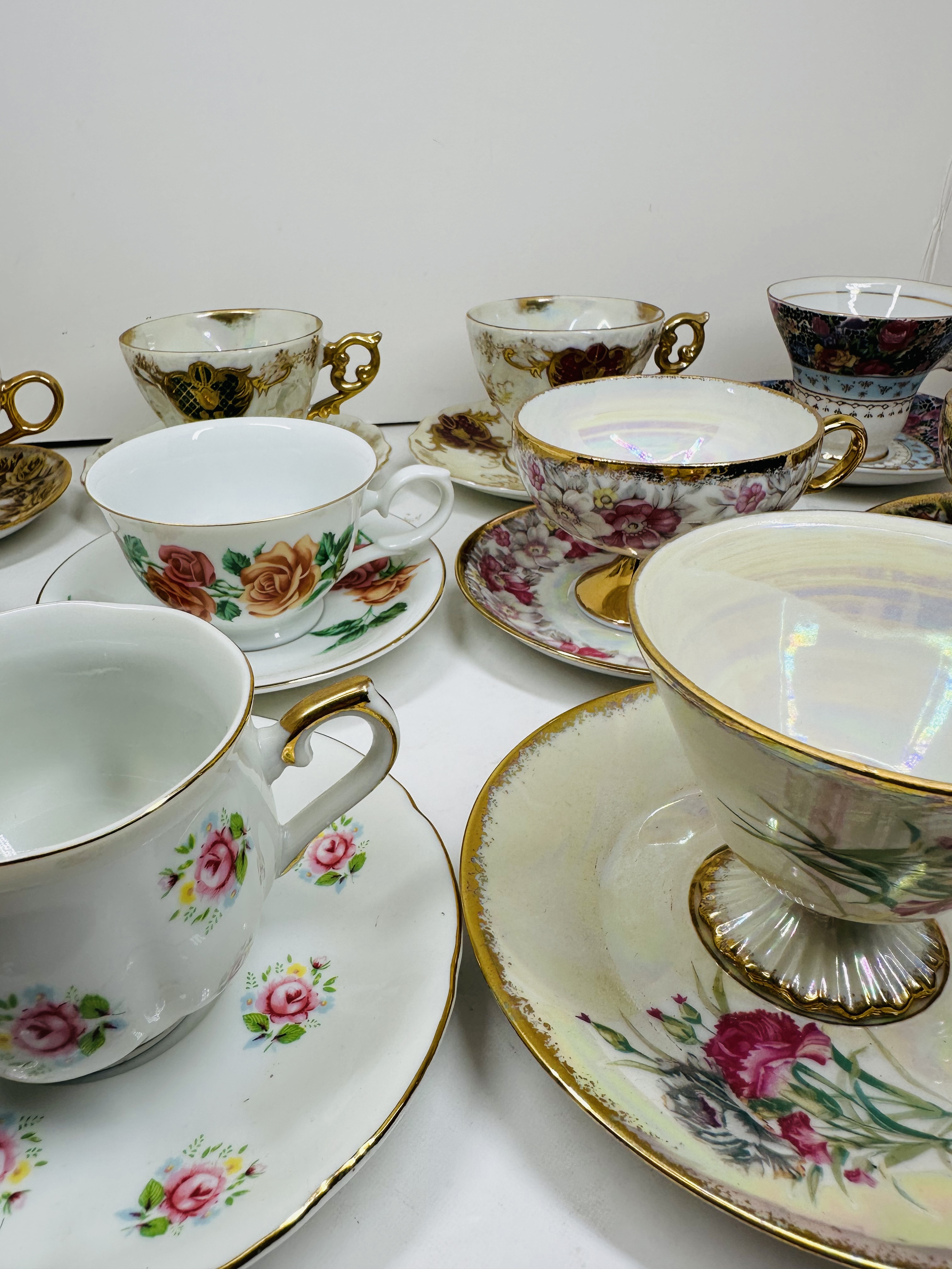 TEN PORCELAIN TEACUP SETS, MID-20TH CENTURY