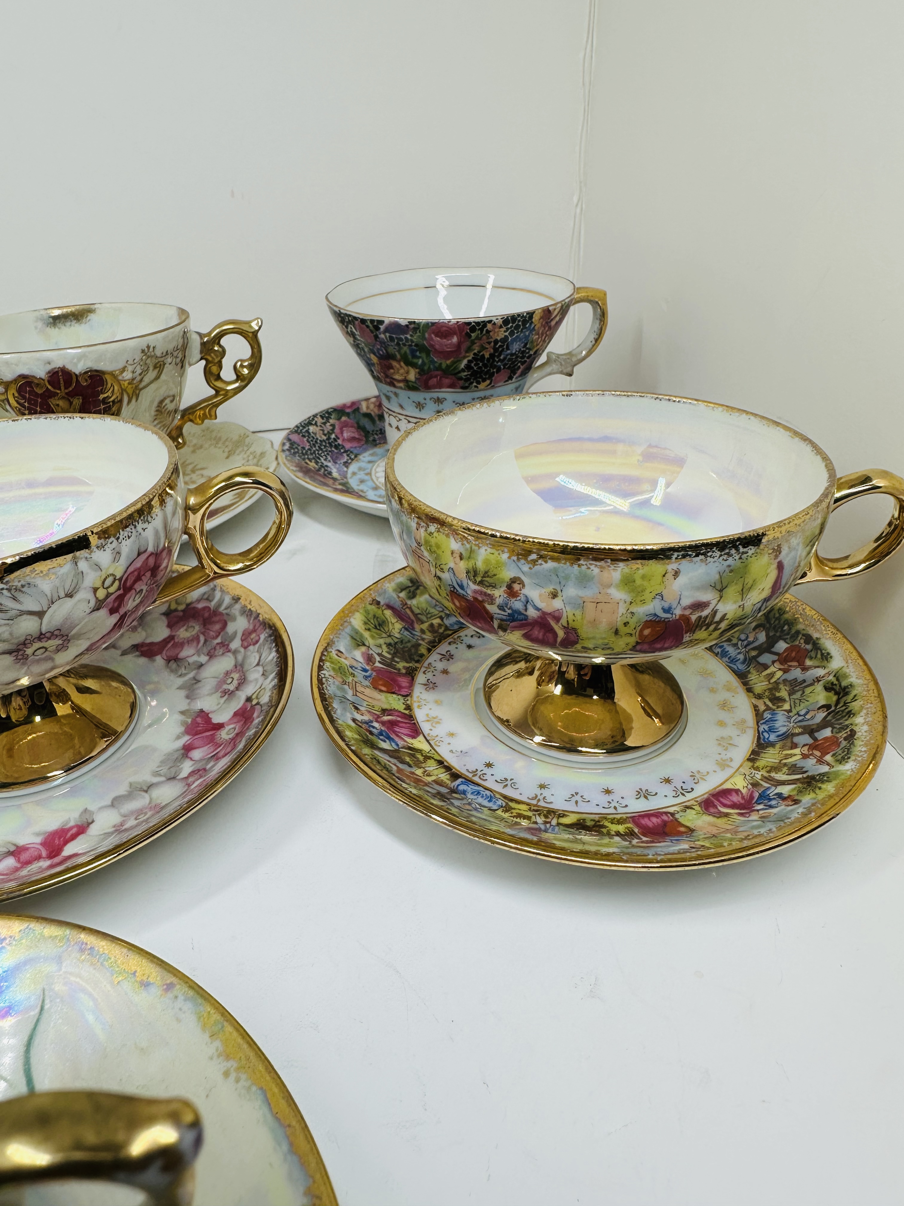 TEN PORCELAIN TEACUP SETS, MID-20TH CENTURY