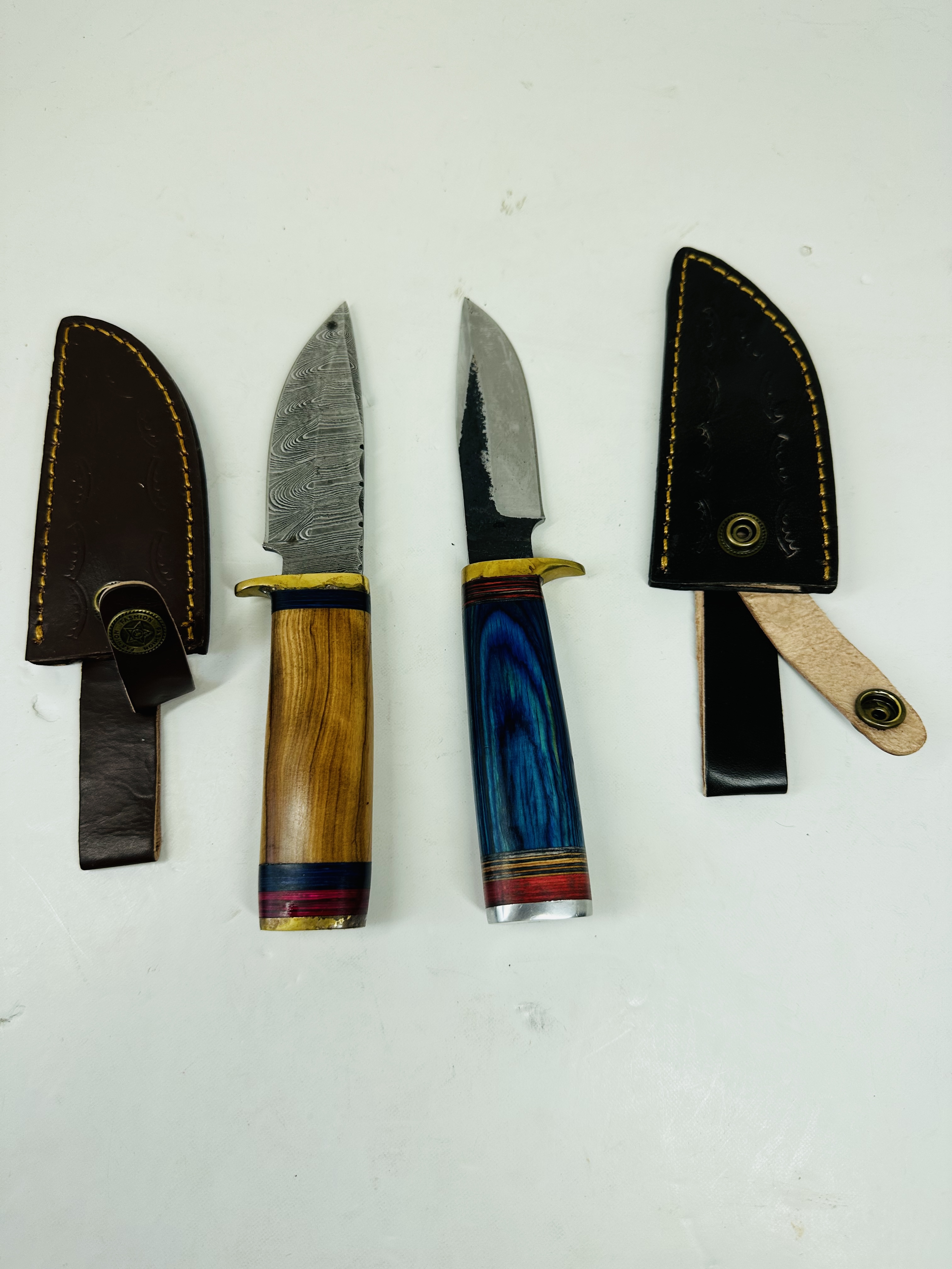 TWO CUSTOM DAMASCUS AND STEEL HUNTING KNIVES