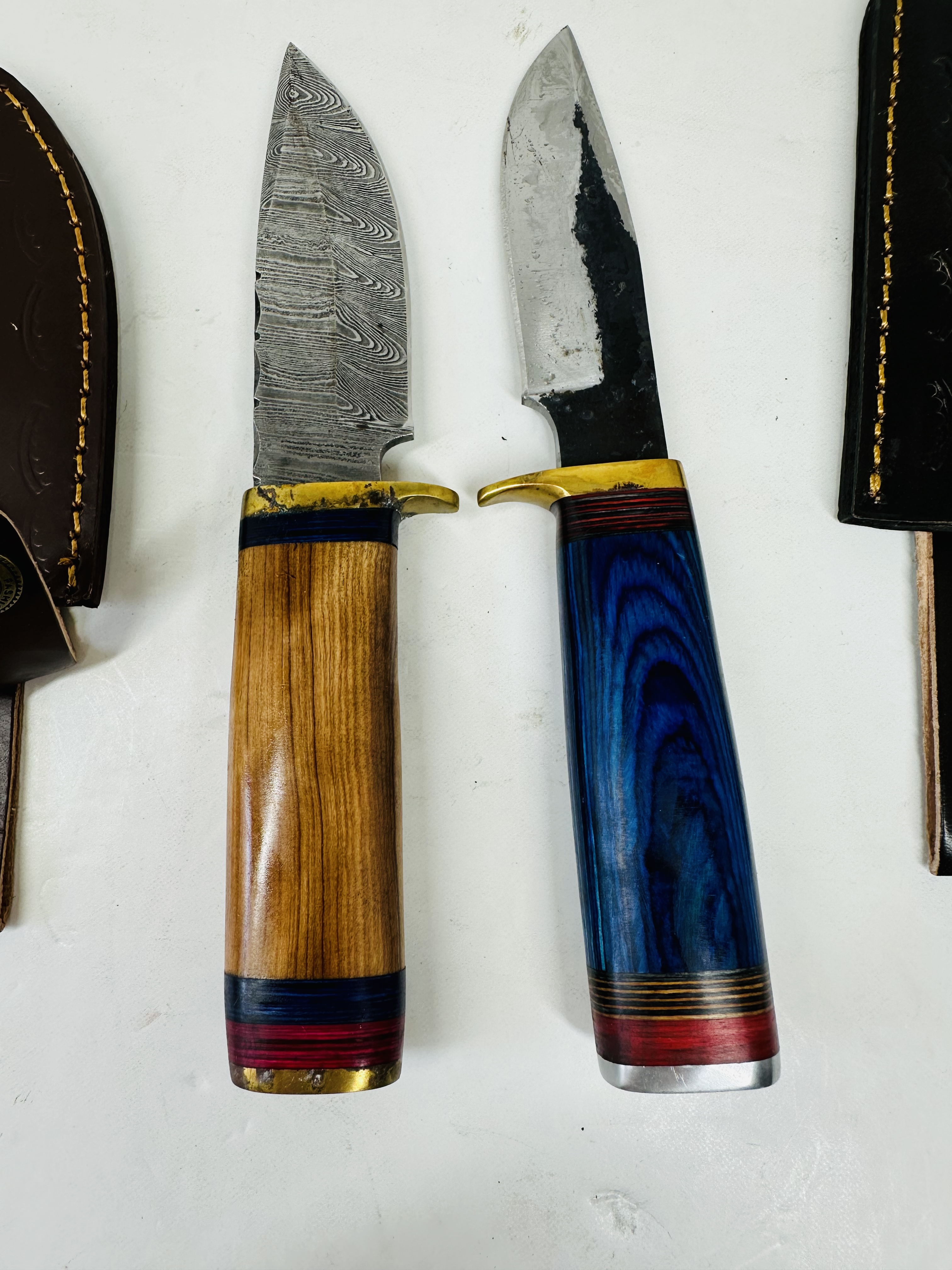 TWO CUSTOM DAMASCUS AND STEEL HUNTING KNIVES