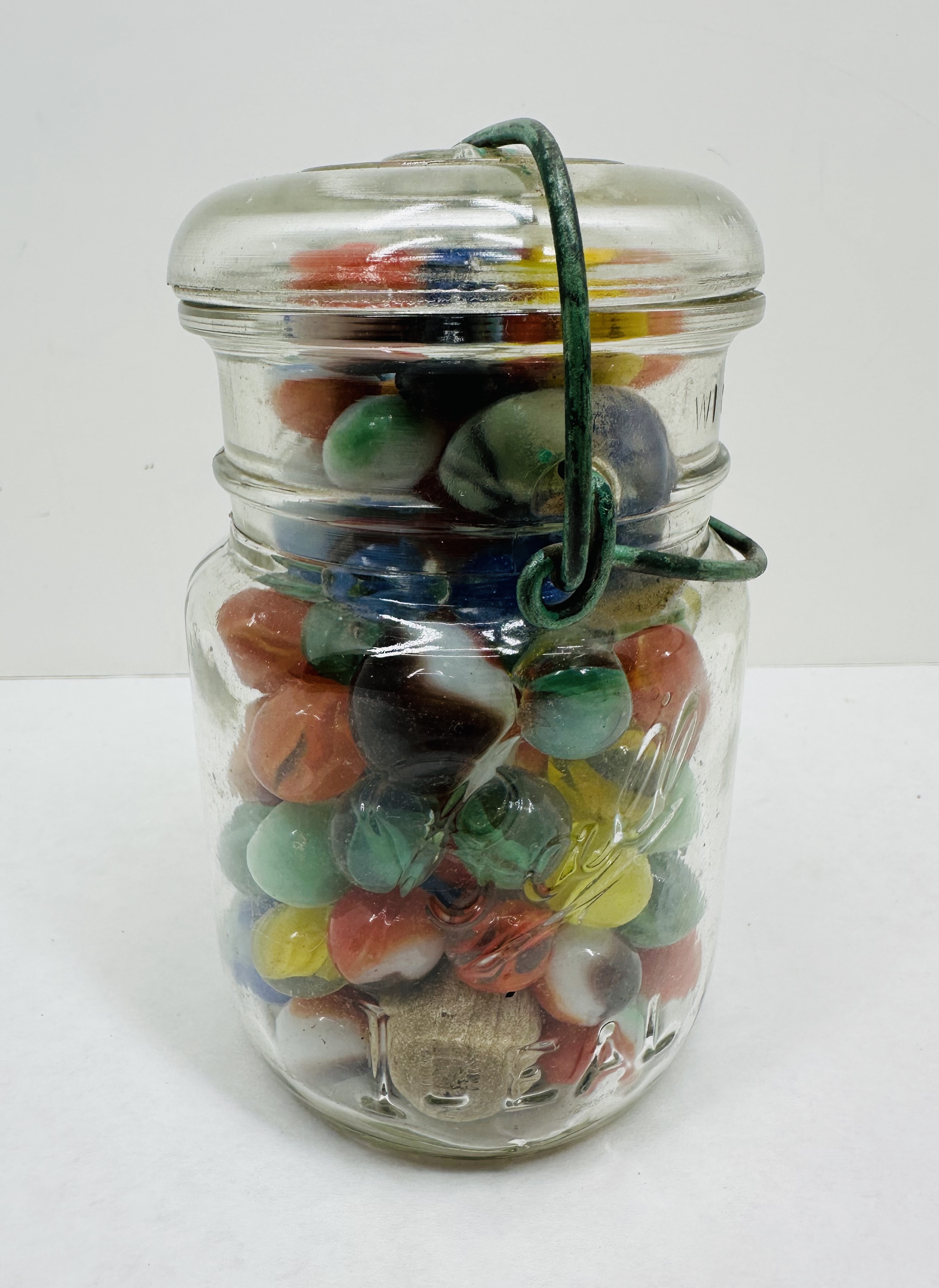 IDEAL GLASS JAR AND MARBLES, MID-CENTURY